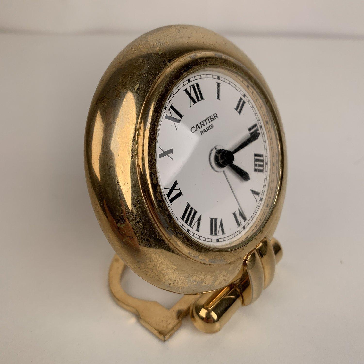 MATERIAL: Metal COLOR: Gold MODEL: Table clock GENDER: Women, Men SIZE: 3.25 x 3.25 inches - 8.9 x 8.9 cm Condition B - VERY GOOD Working condition. New Battery freshly installed. Light surface scratches on metal due to normal use. - Internal Ref: -