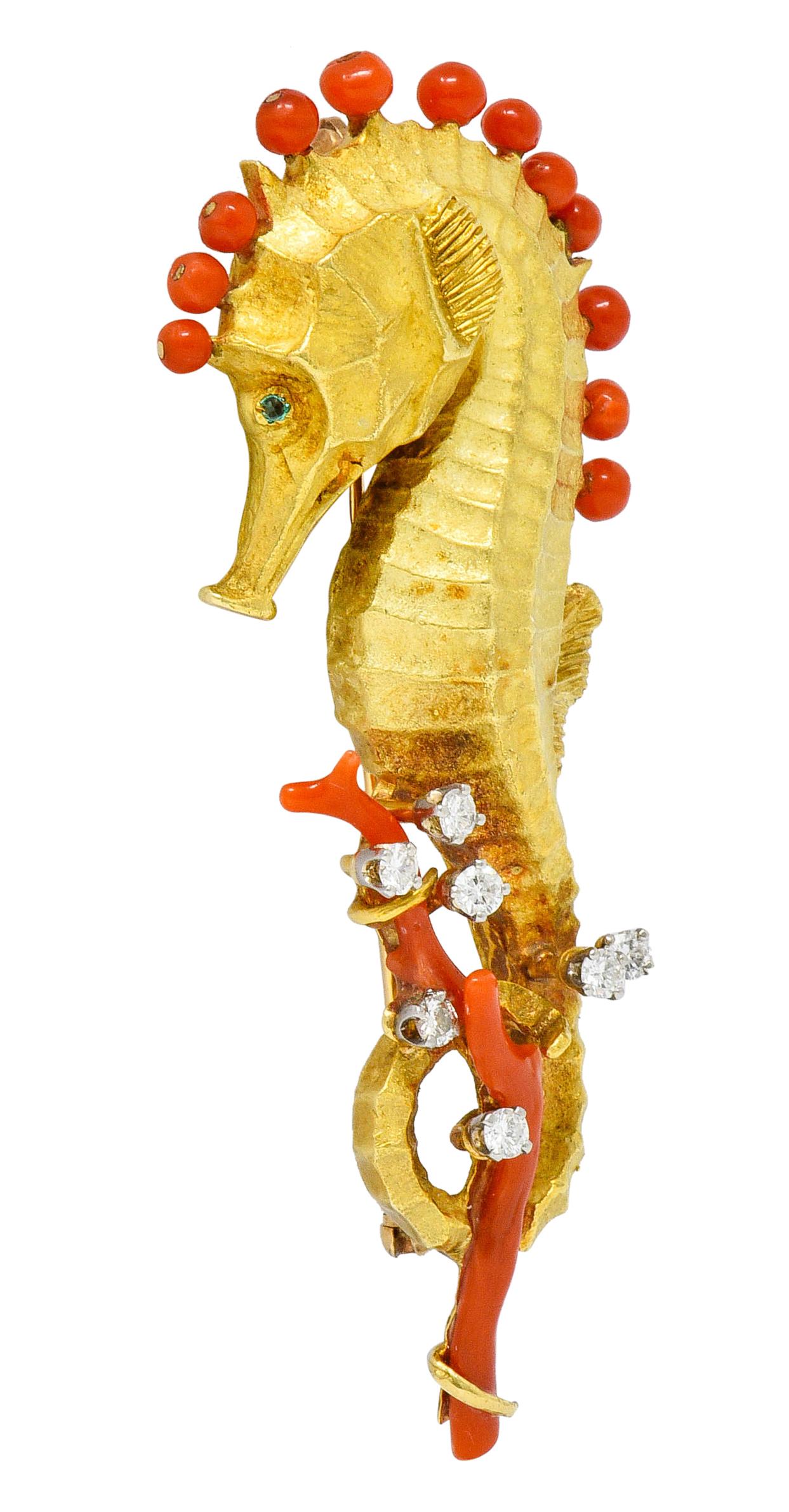 Brooch is designed as a highly rendered matte gold seahorse

With 2.5 to 3.5 mm round bead coral along spine and two branches of coral intertwined with tail

Coral is a very well-matched orangey-red color and is in very good condition

With round
