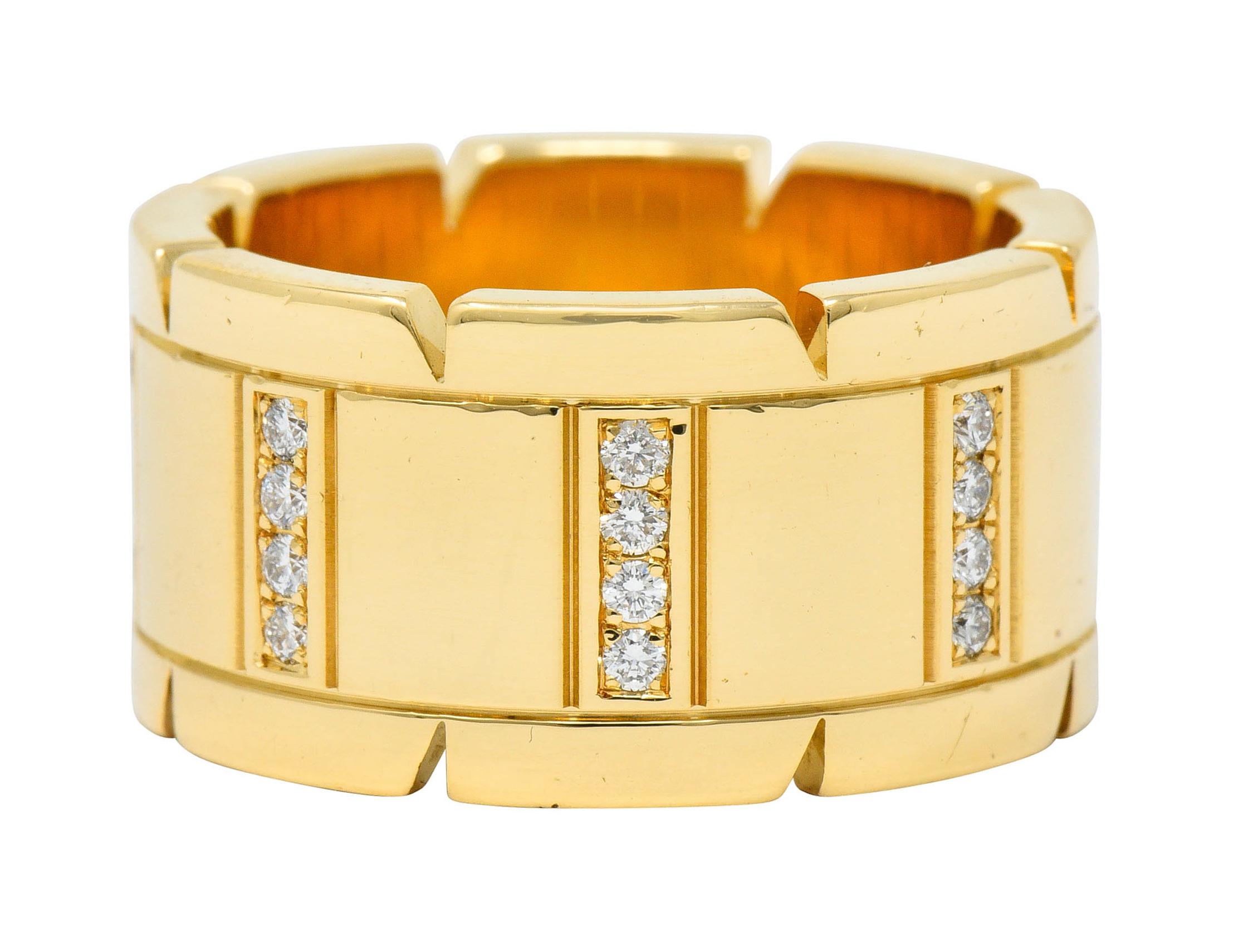 Wide band ring features a deeply engraved center depicting wide and narrow rectangles

Flanked by polished white gold edges with a pierced triangular motif

Accented by round brilliant cut diamonds weighing in total approximately 0.50 carat; F/G