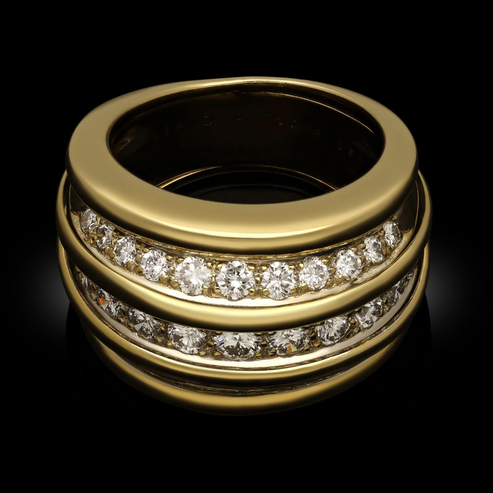 A vintage diamond and yellow gold dress ring by Van Cleef & Arpels, 1980s. The ring is designed with three channels of white round brilliant cut diamonds graduating in size, all grain set in 18ct yellow gold with a bombe shaped, fluted profile