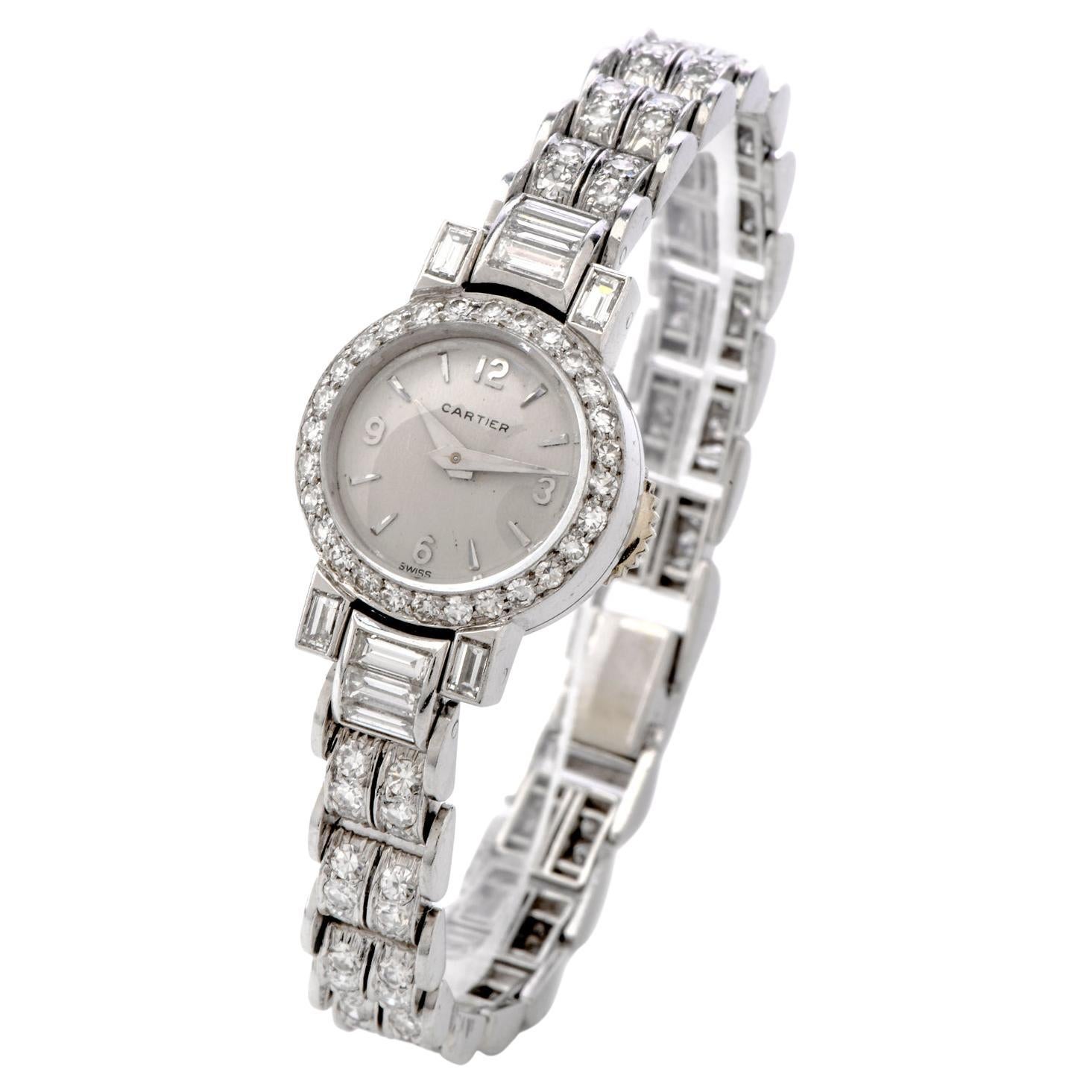 This timeless Vintage Cartier Ladies' diamond watch is crafted in sensual 32.4 grams of platinum. This flexible link watch was created in the 1960s era.   Features 10 large baguette cut Diamonds and 108 round faceted icy white Diamonds surrounding