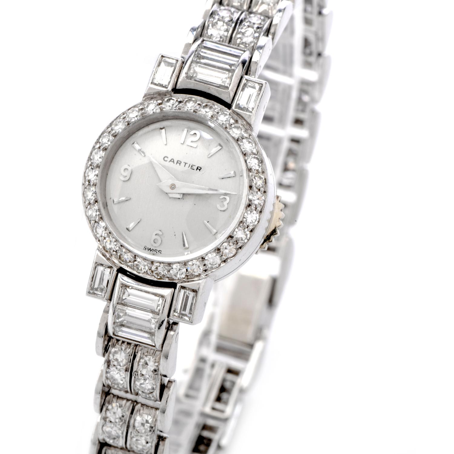 This timeless Vintage Cartier Ladies diamond watch is crafted in sensual 32.4 grams of platinum. This flexible link watch was created in the 1960s era.   Features 10 large baguettes cut Diamonds and 108 round faceted icy white Diamonds surrounding.