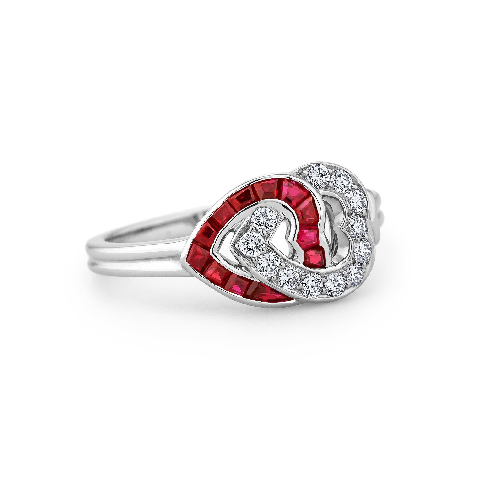 This vintage Cartier ring proves that 'two hearts really can beat as one'.  With one diamond and one ruby heart perfectly intertwined as a whole, this ring speaks of eternal love and commitment.  12 round cut diamonds with a total weight of