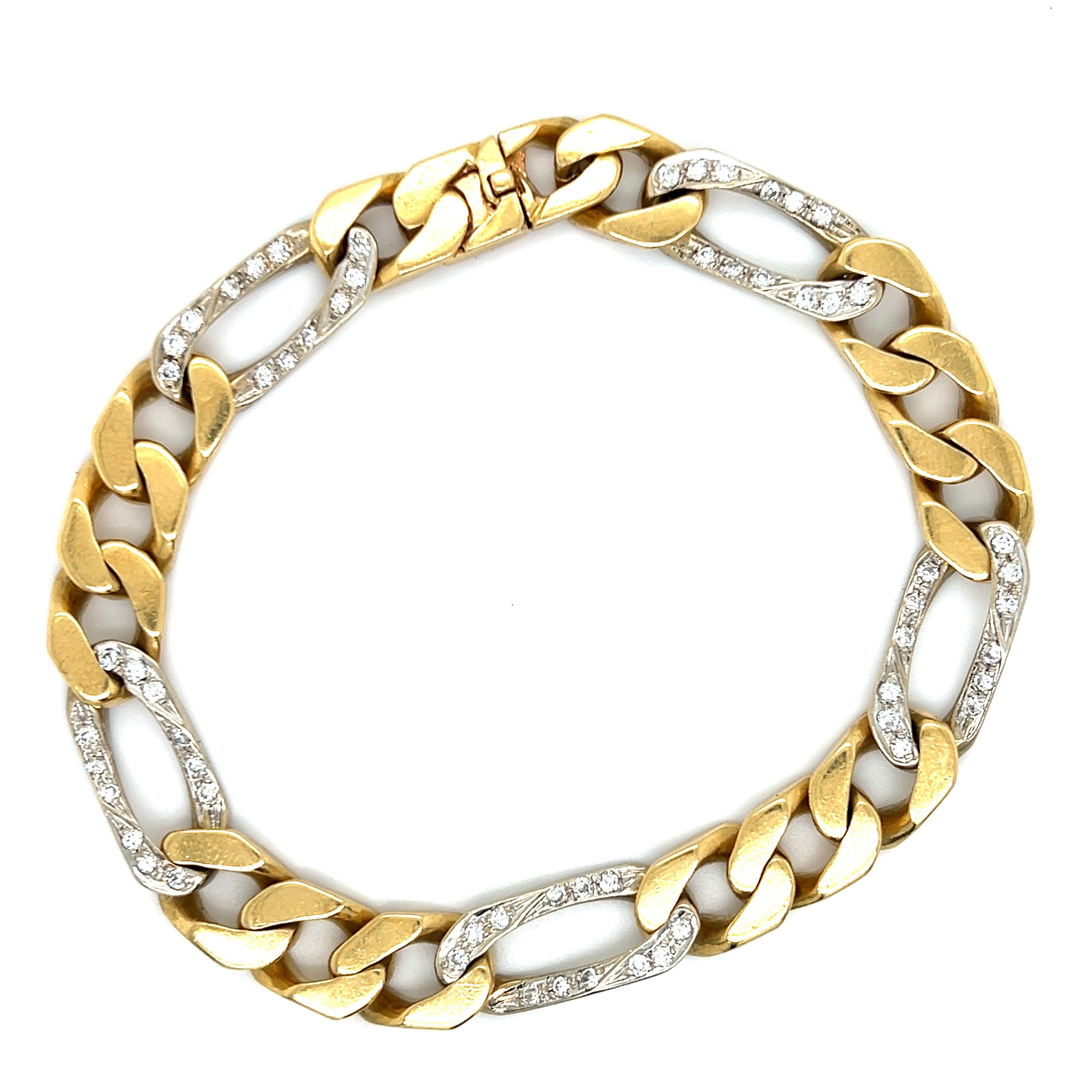 Beautiful vintage bracelet from famed designer Cartier. The bracelet is a Figaro link design that shows a 8.75 mm width. 
 The bracelet is crafted in solid 18k yellow gold and shows five diamond set alternating elongated links. The diamonds in this