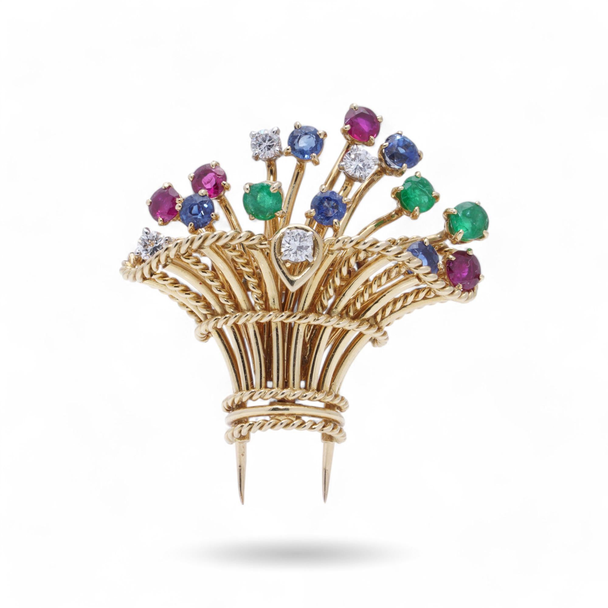 Cartier Vintage Flower Basket Brooch with Diamonds, Rubies, Emeralds, and Sapphires

This vintage brooch by Cartier, crafted in 18kt yellow gold, features a flower basket design with a rope-textured gold basket and gemstone-adorned stems. Made in