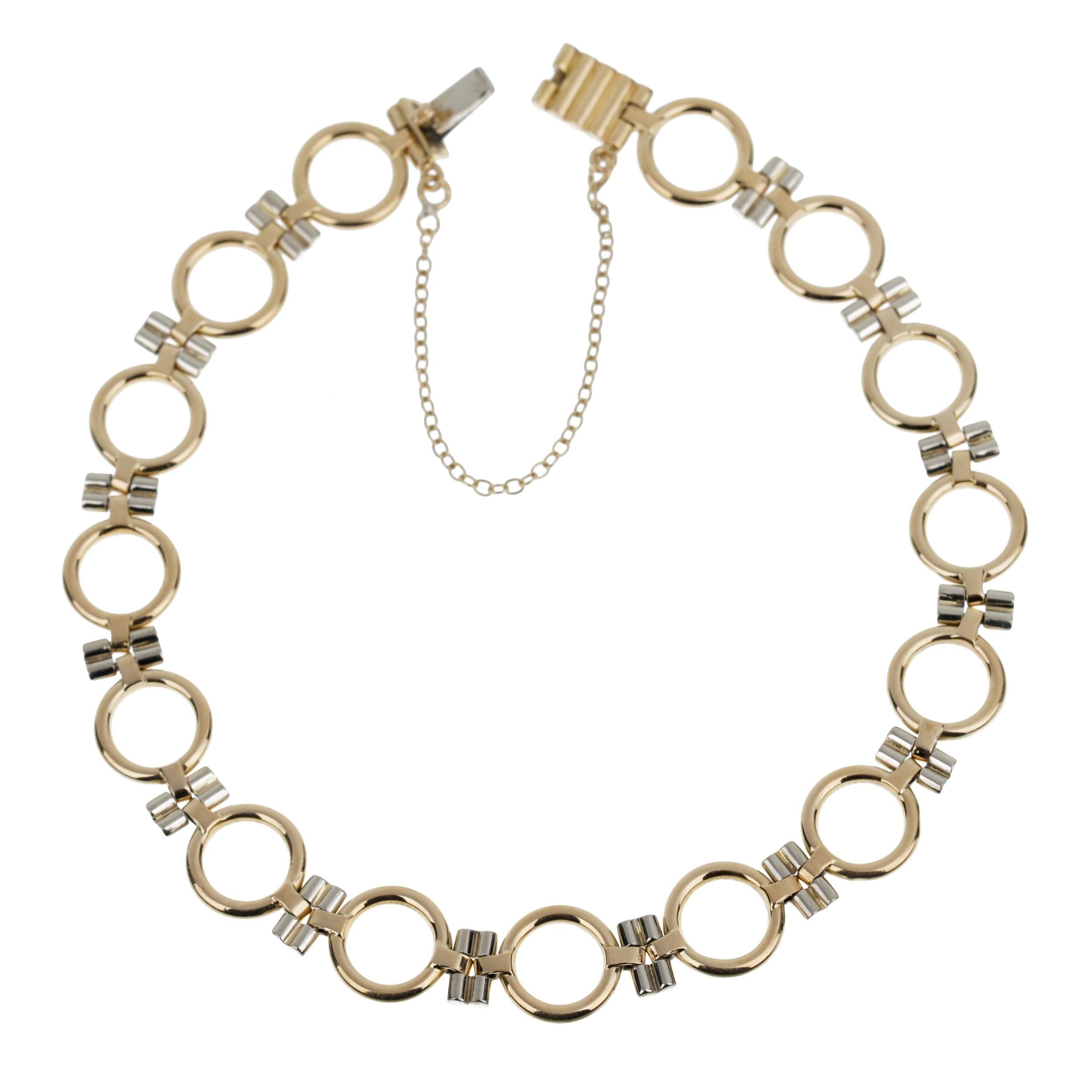 Embrace timeless elegance with the Cartier Vintage Geometric Two Tone Gold Chain Bracelet, a masterpiece of jewelry design that melds classic sophistication with modern geometric flair. This exquisite piece is a testament to Cartier's legacy of