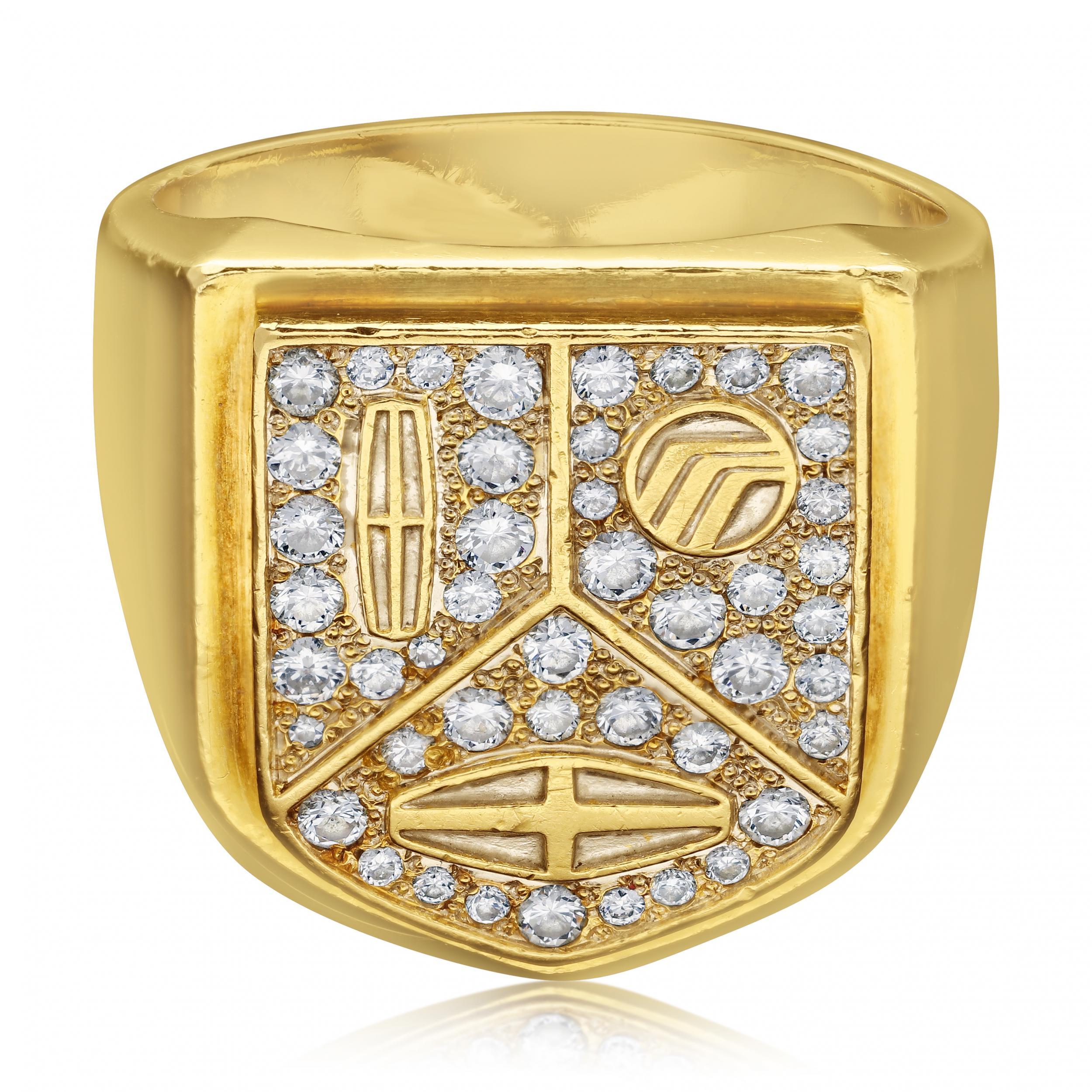Description
A large heavy 18ct gold and diamond signet ring by Cartier c.1985, designed and made for the Lincoln Motor Company, the shield shaped head is divided into three parts each centred with the logo for either Lincoln, Mercury or Merkur cars,