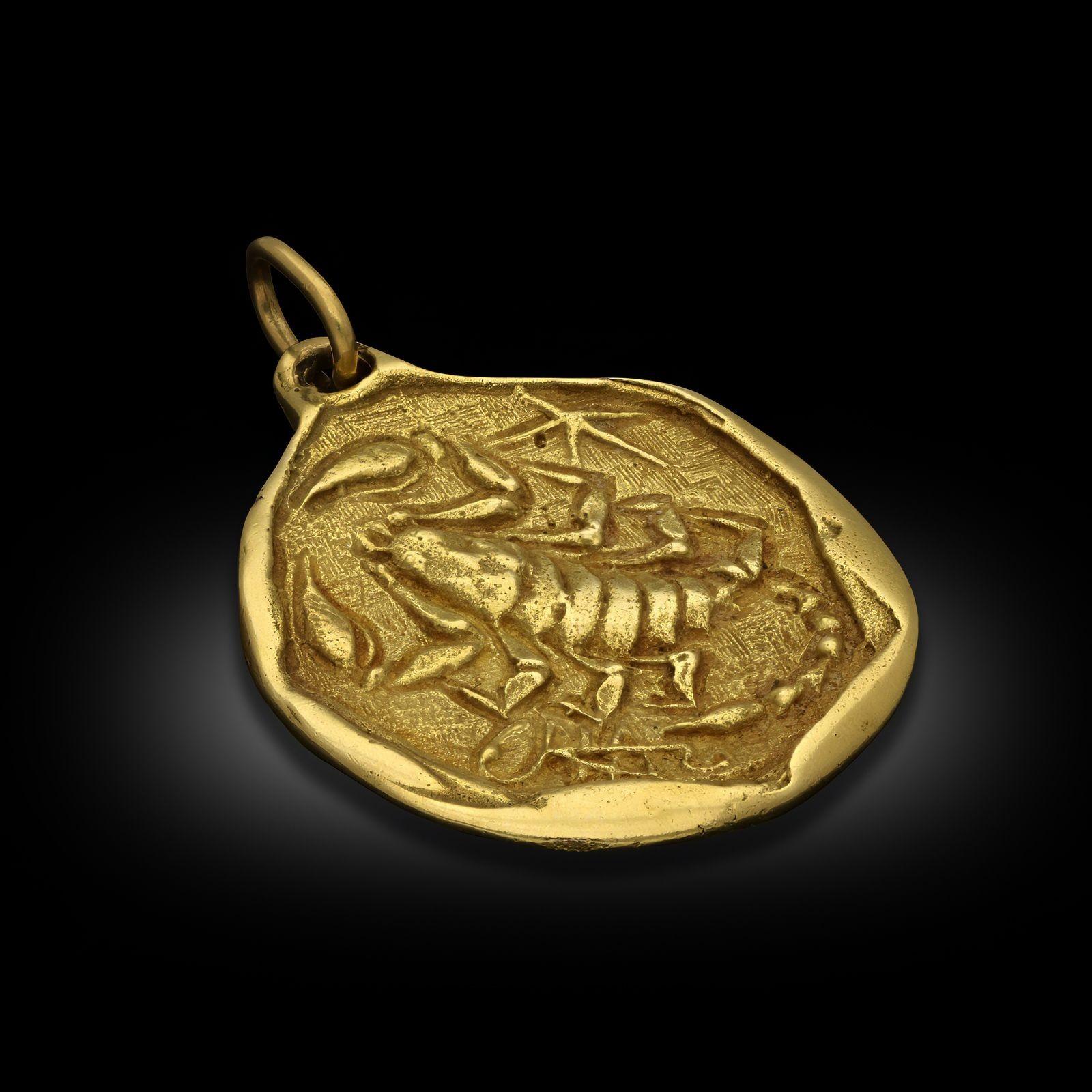 Maker:
Cartier
Summary:
Vintage Jumbo Scorpio Zodiac Pendant in 18ct Yellow Gold
A jumbo vintage Scorpio Zodiac pendant in 18ct yellow gold, by Cartier London, 1975. The design is of a aysmmetric gold disc depicting a scorpion and the stylised