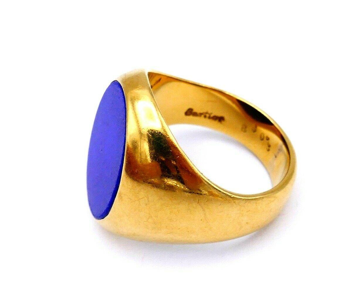 A vintage signet ring by Cartier. Made of 18k yellow gold and lapis lazuli. Stamped with Cartier maker's mark, a serial number and a hallmark for 18k gold. 
Measurements: the ring size is 6.5. Front part is 2/3
