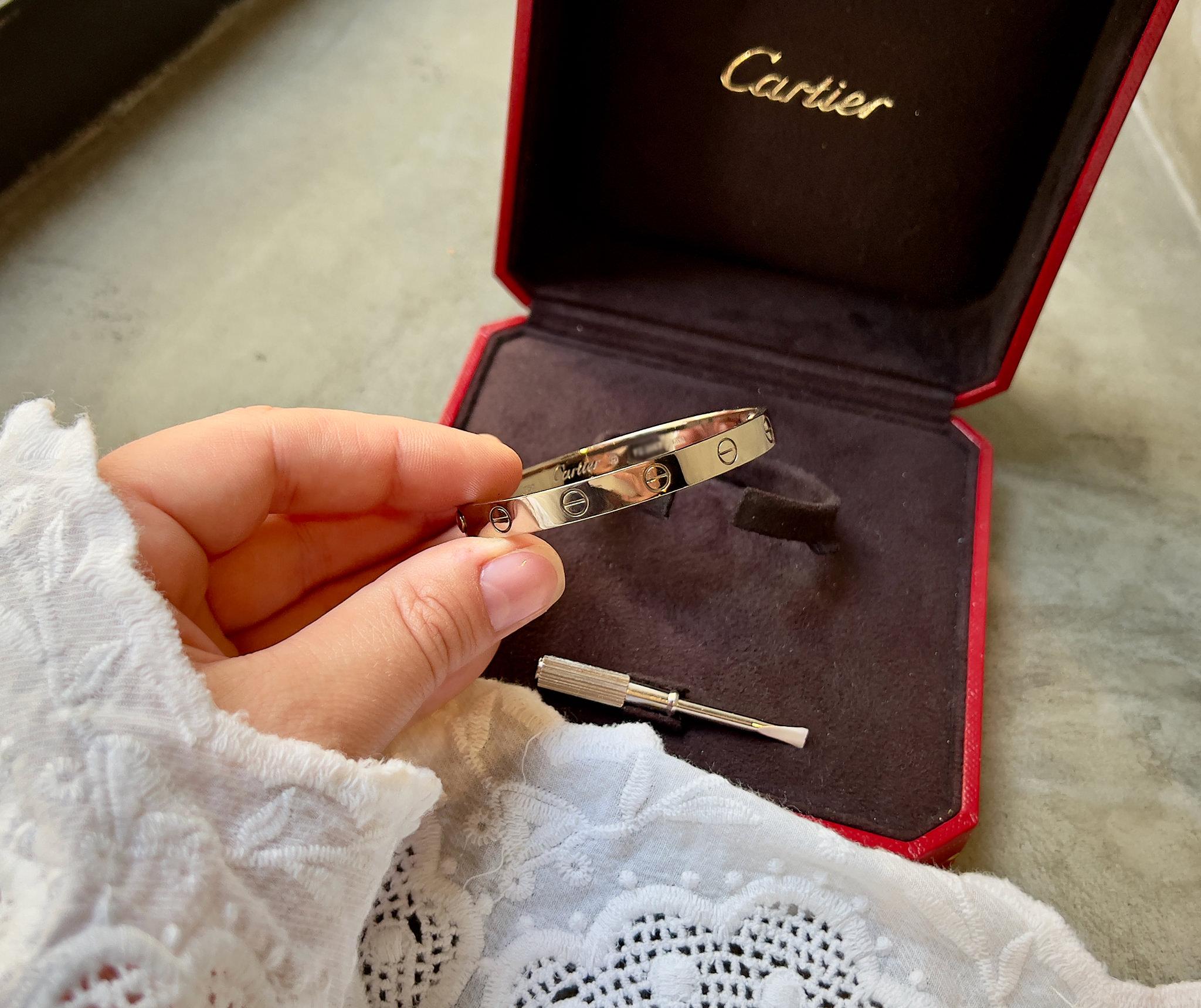 The LOVE bracelet is an icon of jewelry design: a close fitting, oval bracelet composed of two rigid arcs which is worn on the wrist and removed using a specific screwdriver. The closure is designed with two functional screws placed on either side
