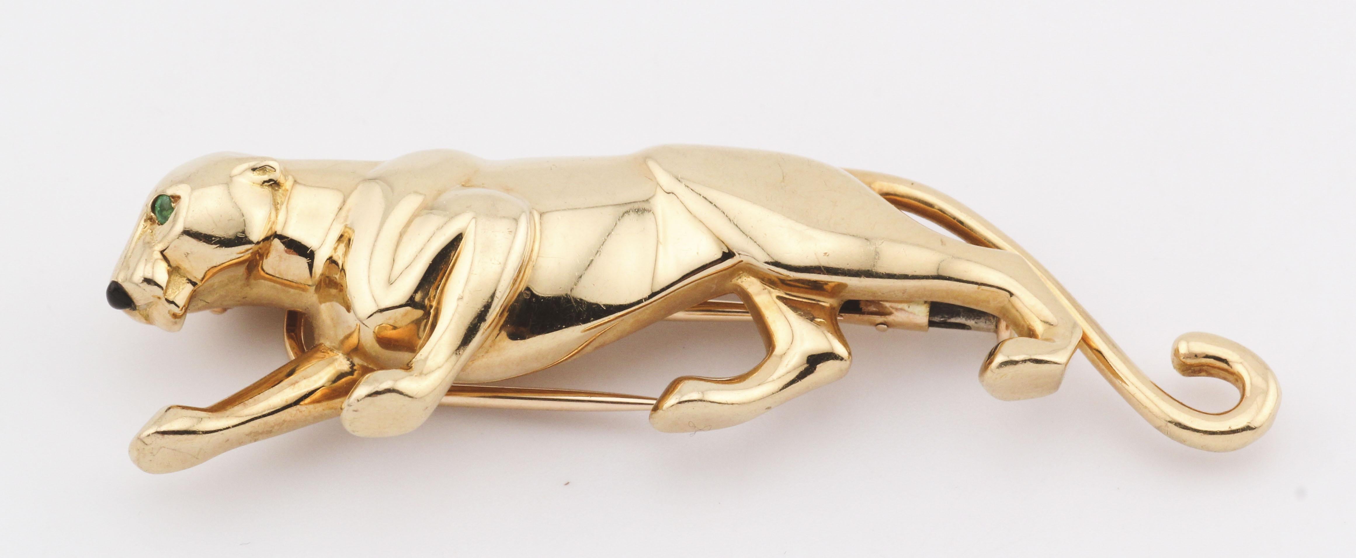 The Cartier 18K Yellow Gold Panther Brooch is a striking piece of jewelry that embodies sophistication and craftsmanship. This exquisite brooch features a sleek panther, a symbol of power and grace, meticulously crafted in 18k yellow gold. The