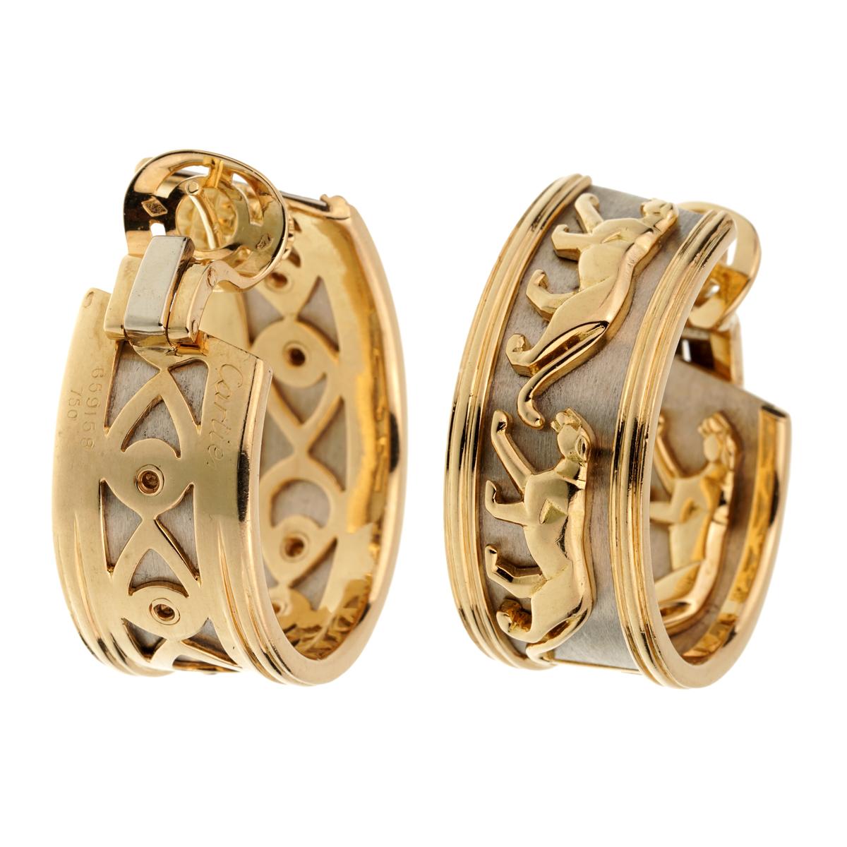 A chic set of iconic Cartier Panthère hoop earrings in yellow gold white gold, composed of 2 significant brushed rings in white gold, holding 4 beautiful stylized panthers yellow gold.

The earrings measure 1.37