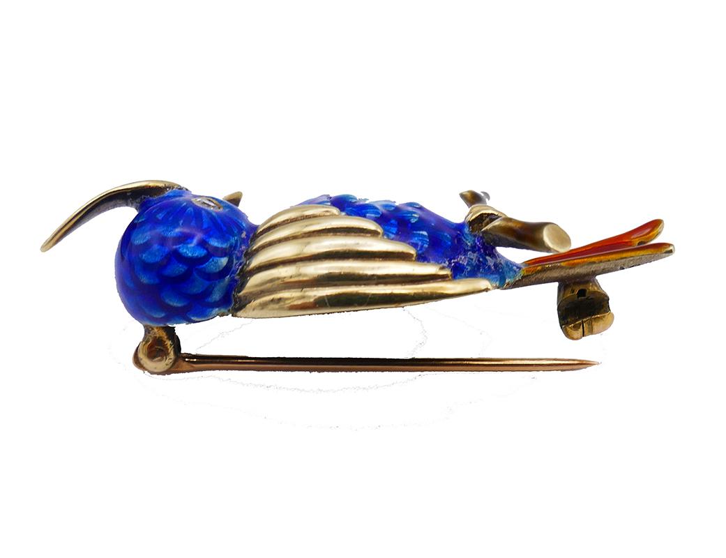 	A lovely vintage Cartier 14k gold pin brooch clip. Designed as a little bird perched on a branch, this fun and stylish Cartier brooch was created in the 1950s. The body and tale are made of enamel. The tuft, beak, wings and the paw are made of