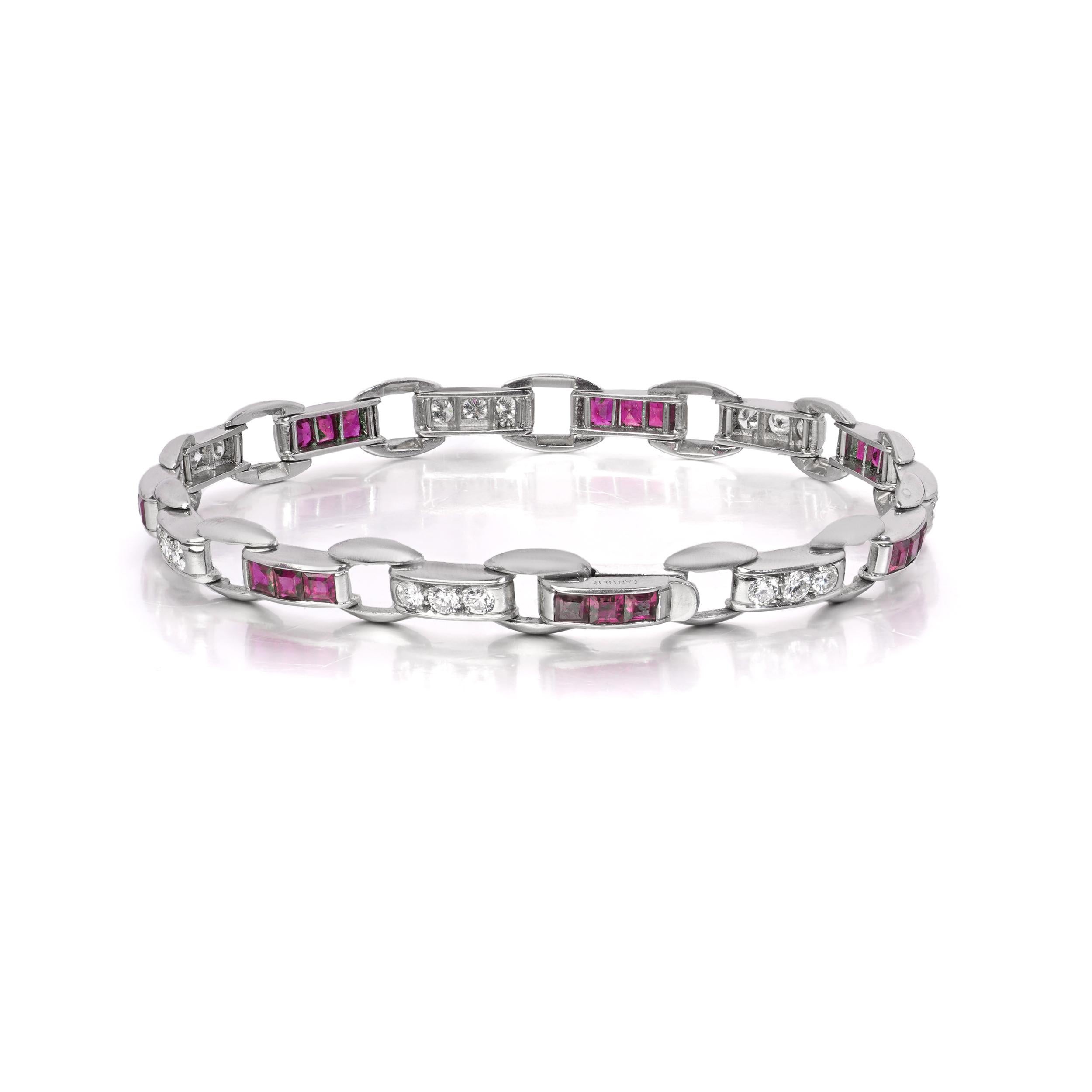 A finely crafted vintage Cartier bracelet in platinum, composed of alternating links set with square-cut rubies and round brilliant-cut diamonds. 
Made in Circa 1940s 

Specifications:
Maker: Cartier
Material: Platinum
Length: 17.5 cm
Width: 0.6