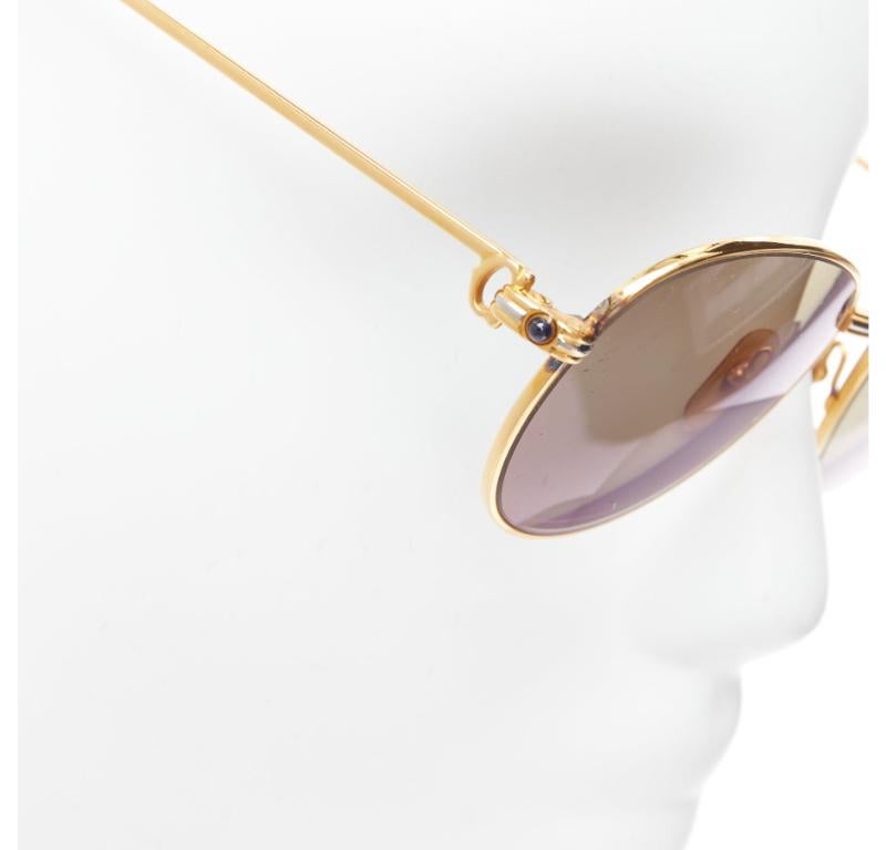 CARTIER Vintage S Sapphire 55-18 gold plated frame green lens sunglasses
Reference: TGAS/E00083
Brand: Cartier
Model: S Sapphire 55 18 135
Material: Metal
Color: Gold, Green
Pattern: Solid
Extra Details: Logo at back of arms.
Made in: