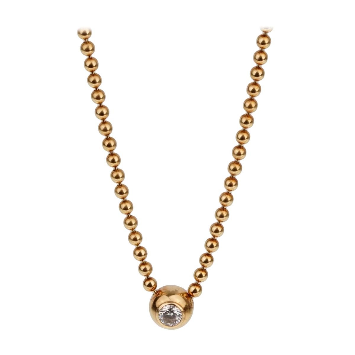 Cartier, collier pendentif solitaire vintage en or et diamants