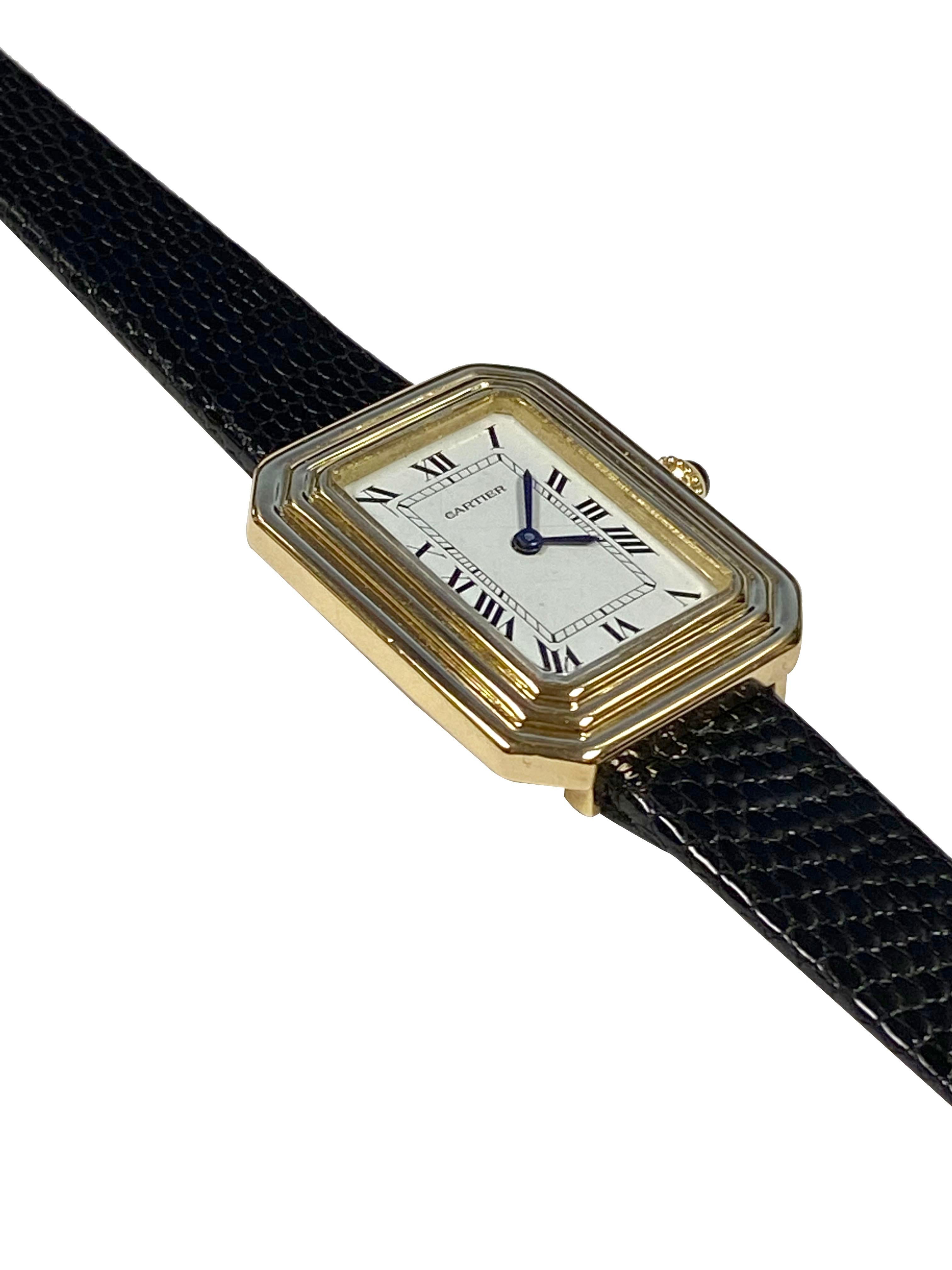 Circa 1970s Cartier Mid Size Wrist Watch, 30 X 24 M.M. 18K Yellow Gold 2 Piece Stepped Case. 17 Jewel Mechanical, Manual wind movement, Sapphire Crown, White Enamel Dial with Black Roman Numerals. New Black Lizard strap, watch length 8  3/4 inches.