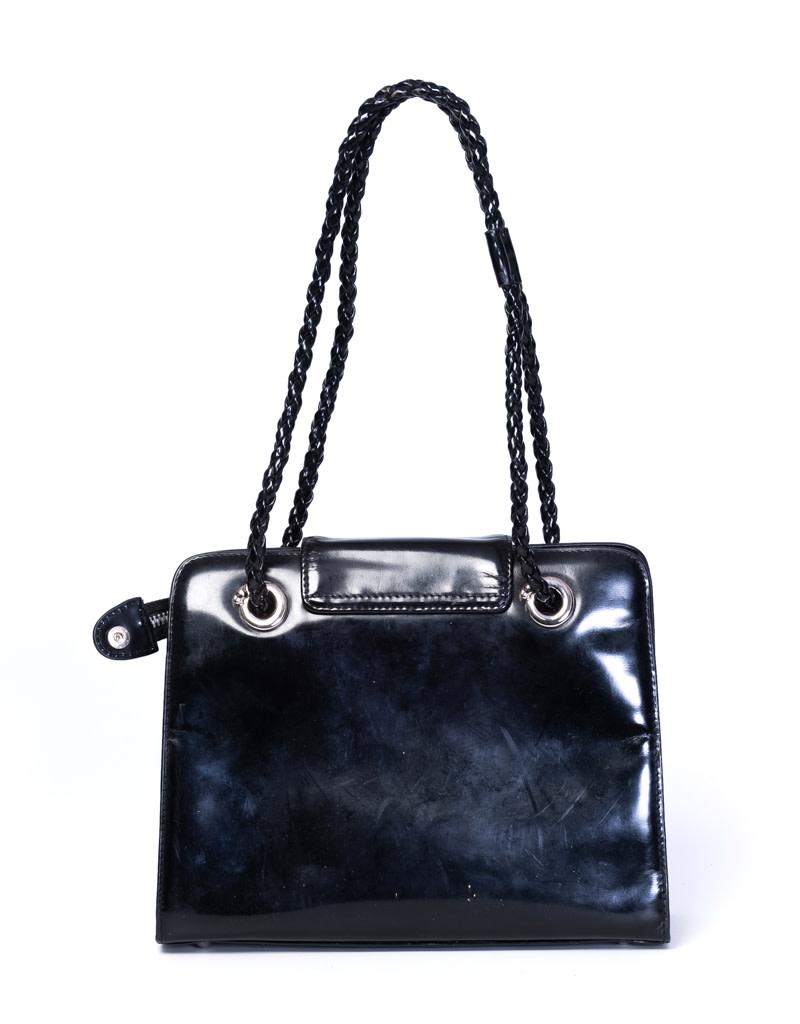 This Panthera bag is designed with a silver toned metal hardware and their well known vintage Panthere logo. It is also crafted in a luxurious structured patent leather. The zipper opens to a cheetah print woven fabric interior lining.

COLOR: