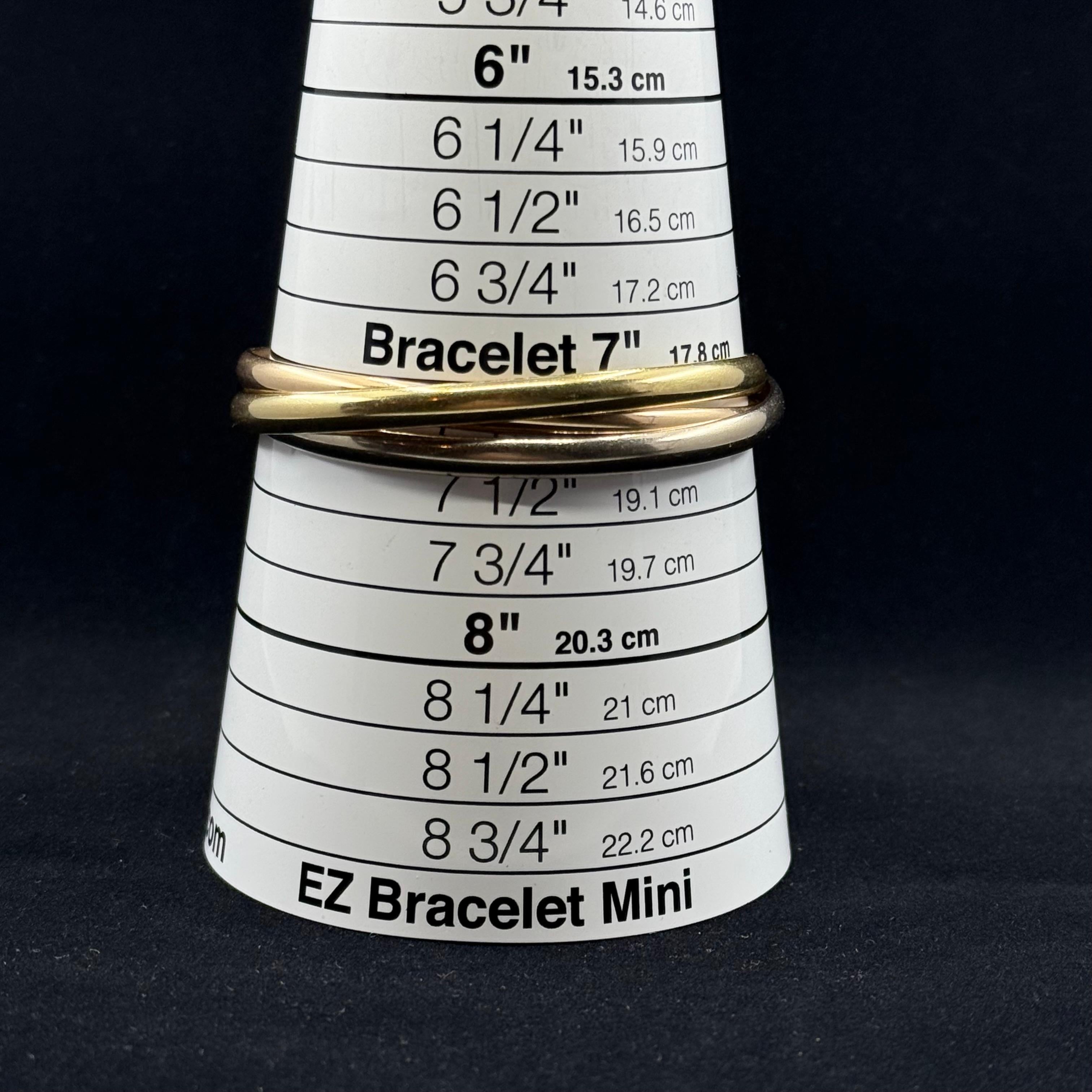 Cartier Vintage Trinität  18 Karat Tri Gold 60 Gramm Armreif Armband im Zustand „Gut“ in Beverly Hills, CA
