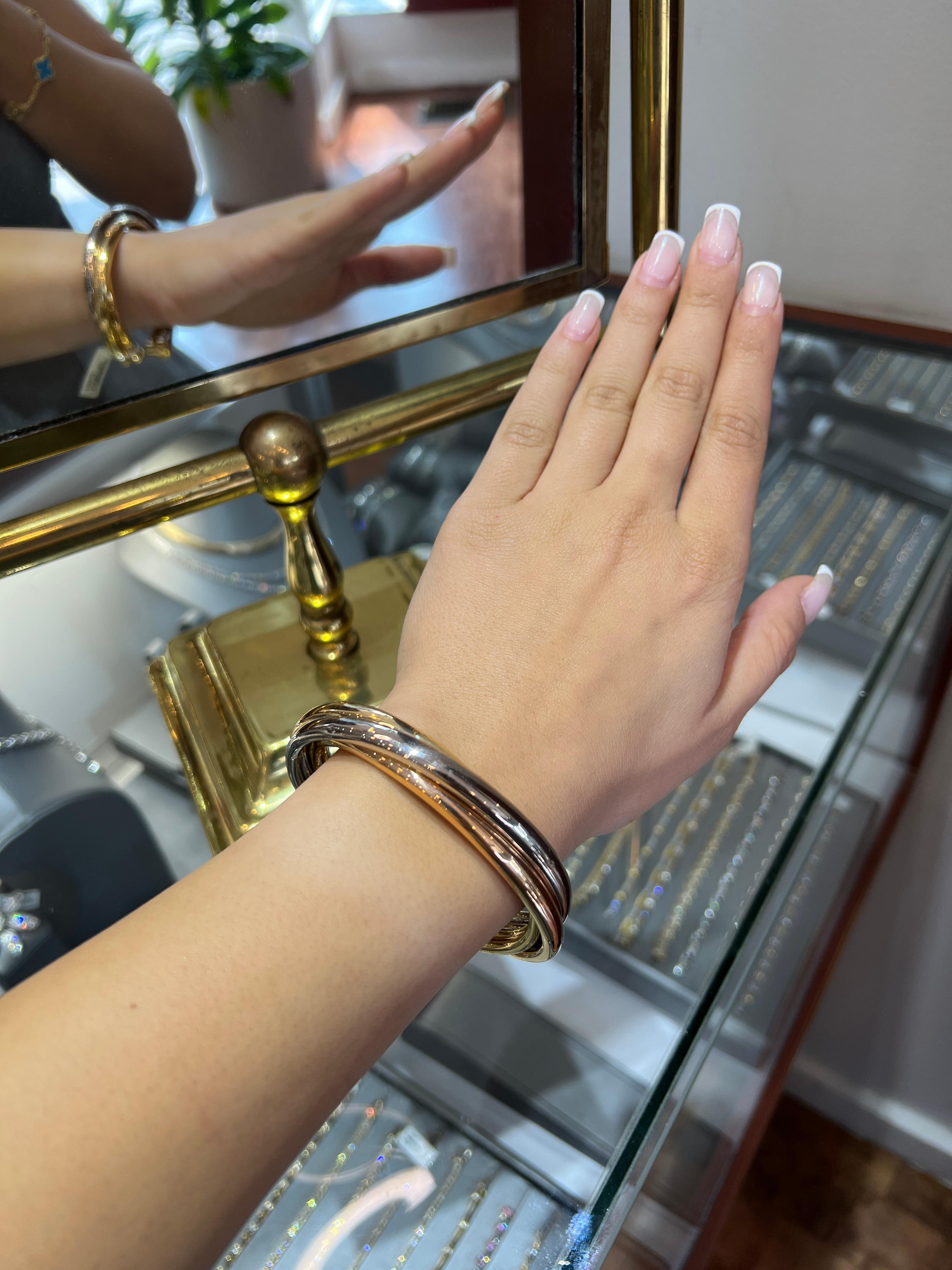 Bracelet manchette à trois bandes en or jaune, blanc et rose 18k de Cartier Vintage Trinity Excellent état - En vente à Great Neck, NY