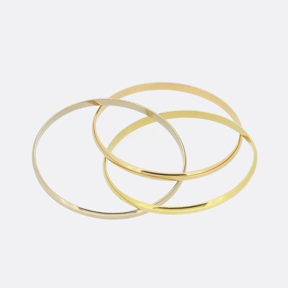 This is a vintage bracelet from the luxury jewellery designer Cartier. The trinity bracelet features three interwinding bangles of different coloured gold and weighs an impressive 62.4 grams.

Condition: Used (Excellent)
Weight: 62.4 grams
Inside