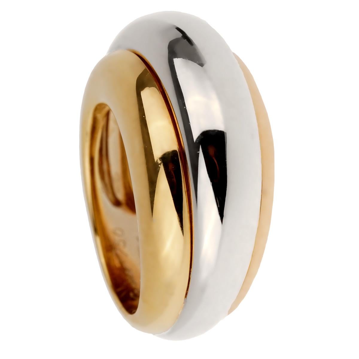 A rare Cartier ring from the Trinity collection circa 1990's showcasing white, yellow and rose gold in 18k yellow gold. Size 52 / 6 1/4