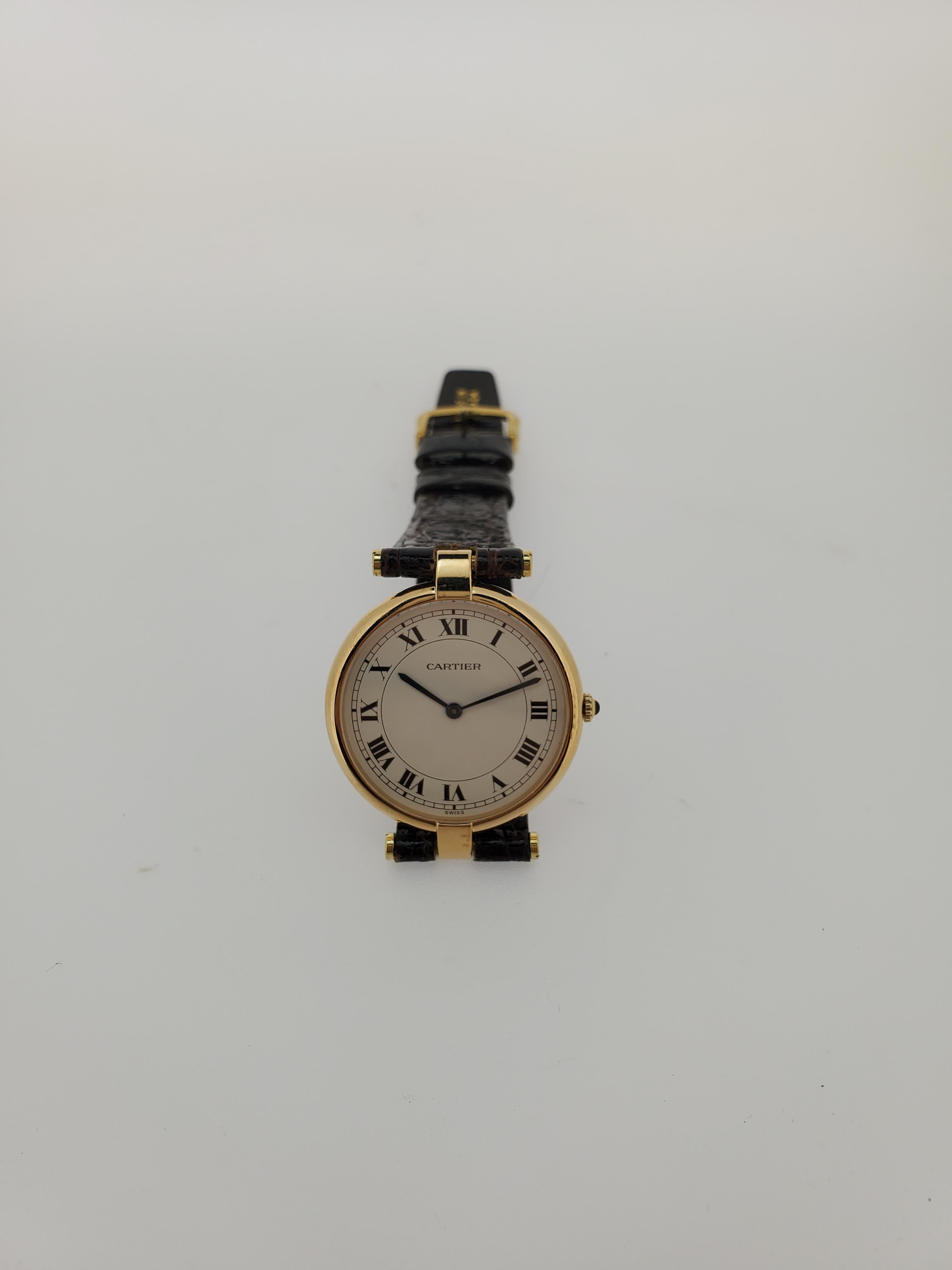 Introduction:
This Vintage Cartier Vendome Round watch With roman numerals, large size, circa 1980-1985.  It is made in 18K yellow gold and measures 30 mm with Cartier Quartz  movement.  It has a crocodile strap.  further with instructions and