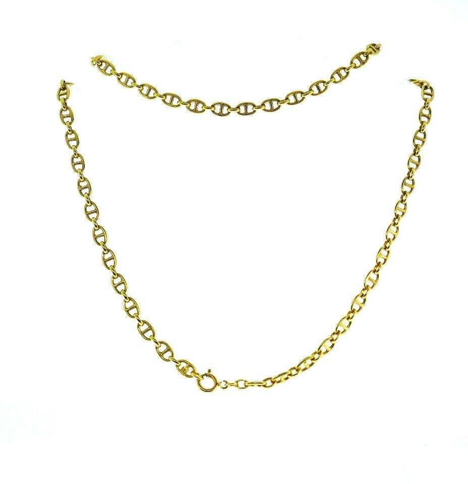 Long vintage anchor link chain necklace by Cartier made of 18k yellow gold. Stamped with the Cartier maker's mark, a hallmark for 18k gold and a country of origin (Italy). 
Measurements: 27