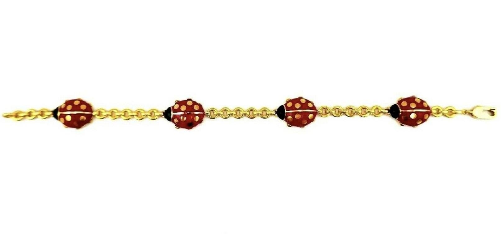 A well-known vintage Ladybug bracelet by Cartier. Made of 18k yellow gold and enamel. 
Stamped with Cartier maker's marks, a serial number, a year of production (1990) and a hallmark for 18k gold. 
Measurements: 7