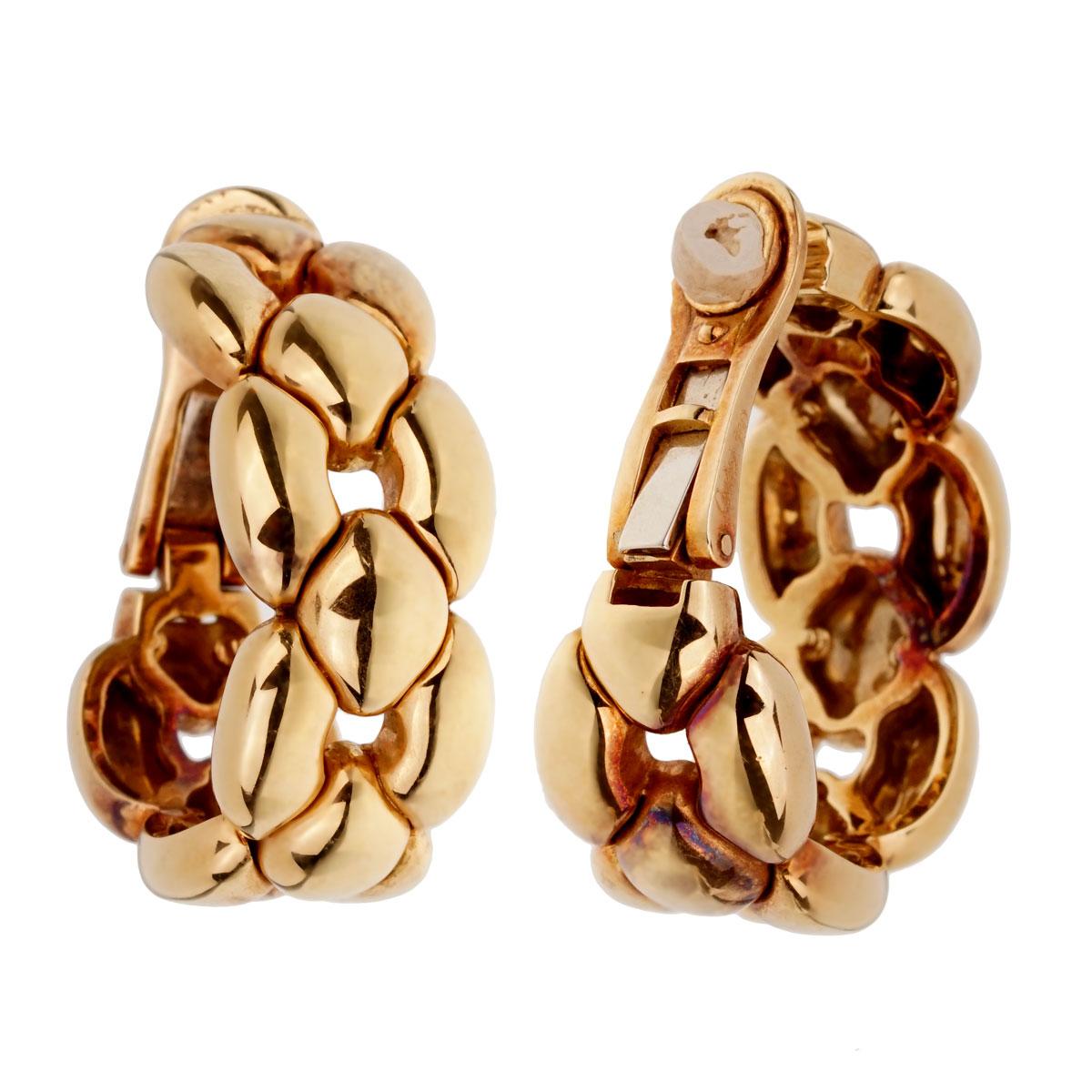 A magnificent set of Cartier hoop earrings crafted in 18k yellow gold. The earrings measure .50