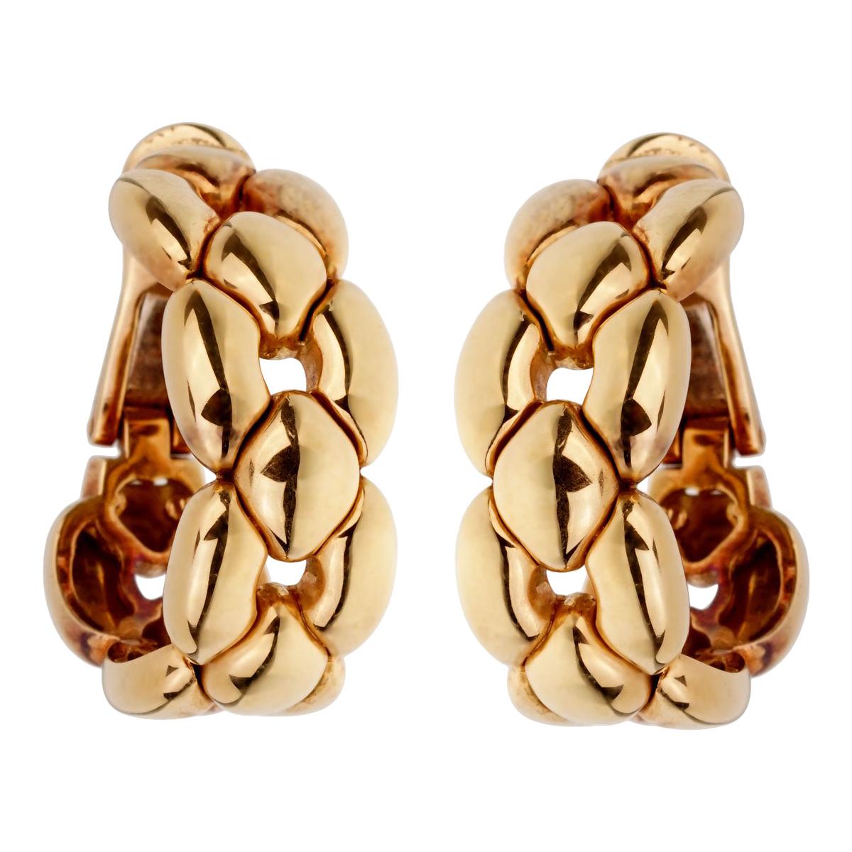 A magnificent set of Cartier hoop earrings crafted in 18k yellow gold. The earrings measure .50