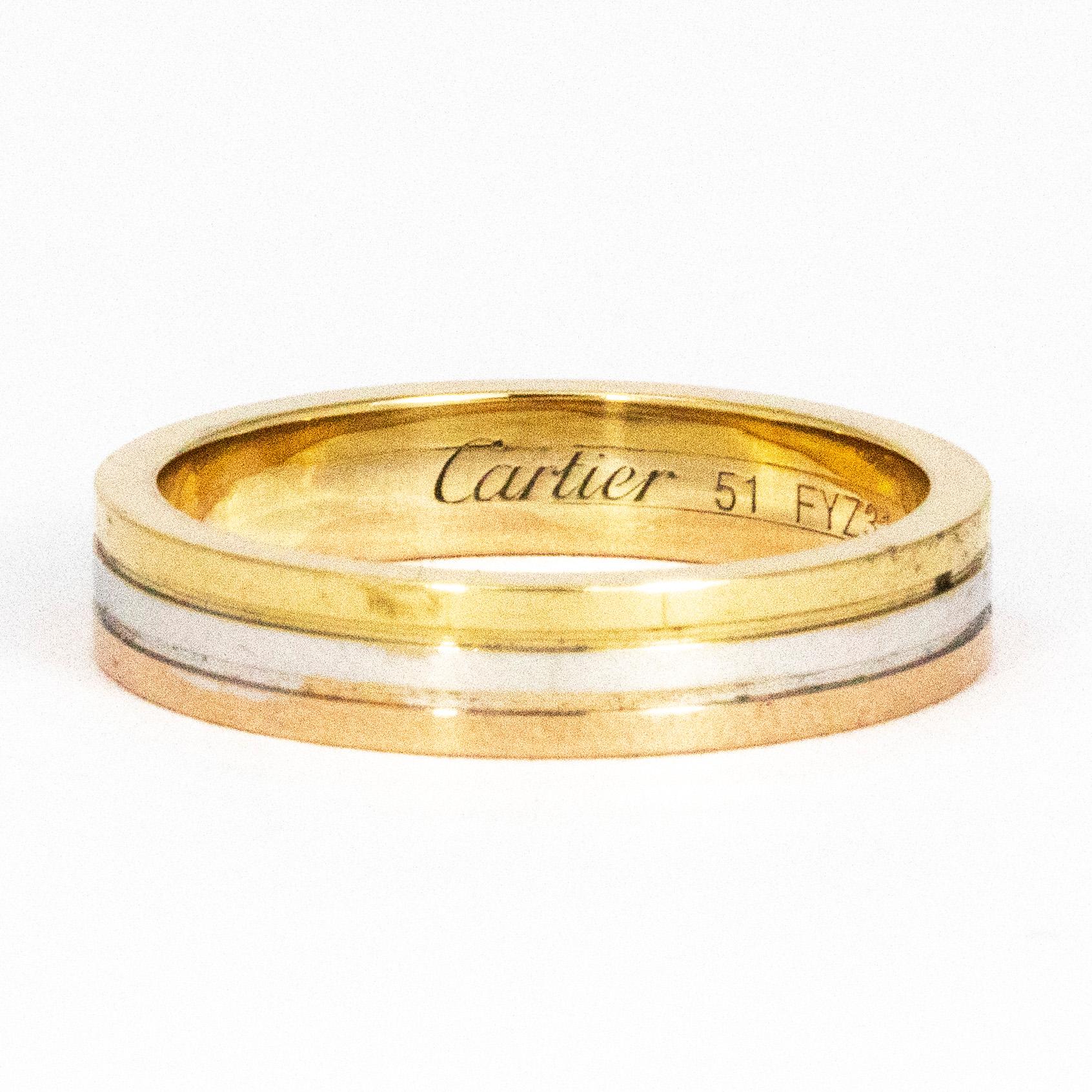 This gorgeous Cartier triple metal band features three tones of gold and is called a trinity band. The three colours are yellow gold, rose gold and white gold. The Cartier signature is inside the band as you can see on the images.

Ring Size: L 1/2