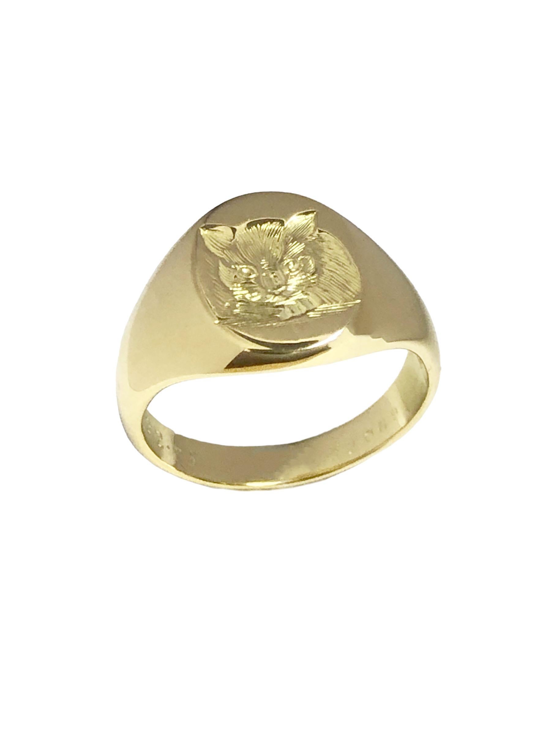 Circa 1970 Cartier 18k Yellow Gold Signet Ring the top measures 1/2 x 3/8 inch and features a deep hand chased depiction of a cat. Weighs 9.4 Grams, finger size 7 1/2, signed, numbered and comes in the original presentation box.