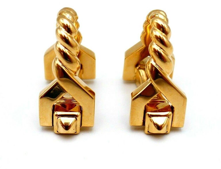 A pair of 18k yellow gold stirrup-shaped cufflinks by Cartier. Stamped with Cartier maker's mark, a hallmark for 18k gold and French marks.
Measurements: 3/4” H x 1” W. The weight is 17.5 grams.