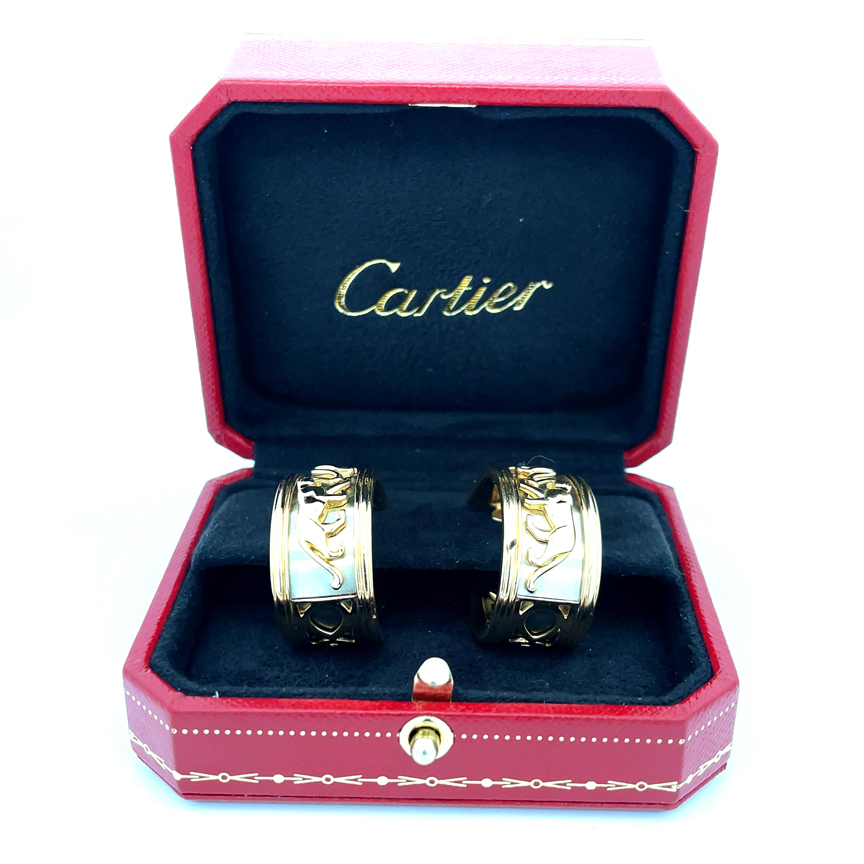 Cartier Walking Panther Earrings  in 18K Gold. The earrings are signed Cartier 750 with maker and French assay mark. Vintage Cartier from the 1980s. The earrings are 1 3/8 inch long, 13mm wide, and weigh 46.5 grams.