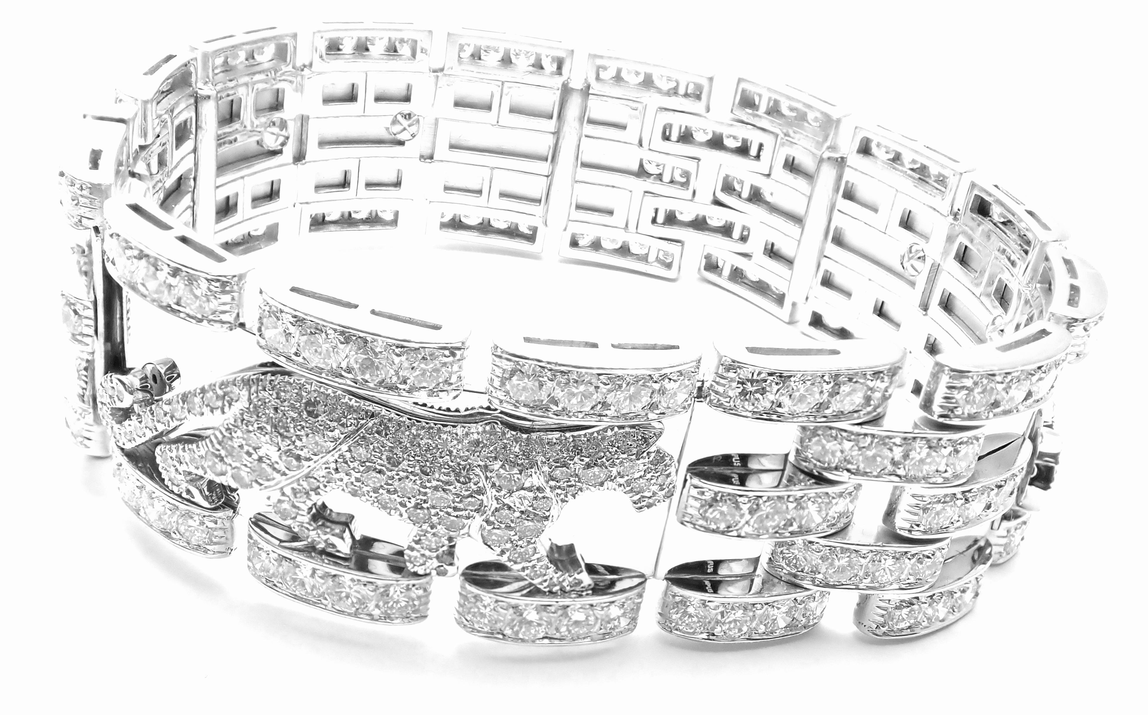 18k White Gold Diamond Walking Panther Bracelet by Cartier. 
Width 417 Round brilliant cut diamonds E color, VVS1 clarity total weight approx. 18.5ct
This watch comes with original Cartier box.
Details:
Length: 7 1/4