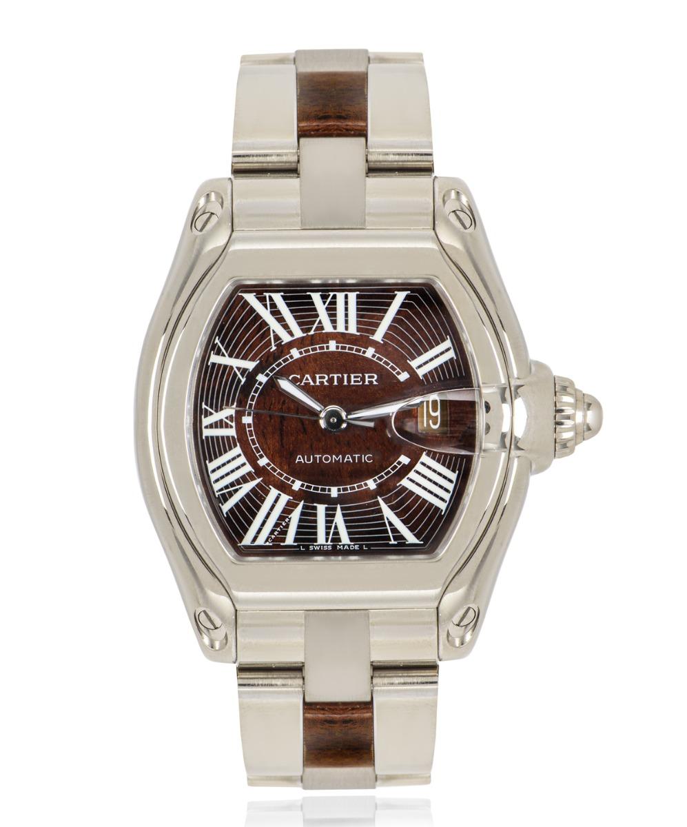 This is a rare and captivating limited edition white gold walnut 42mm roadster created by Cartier. The dial is made of a polished walnut wood akin to those found in the most luxurious of cars and protected by sapphire crystal glass. 

The bracelet