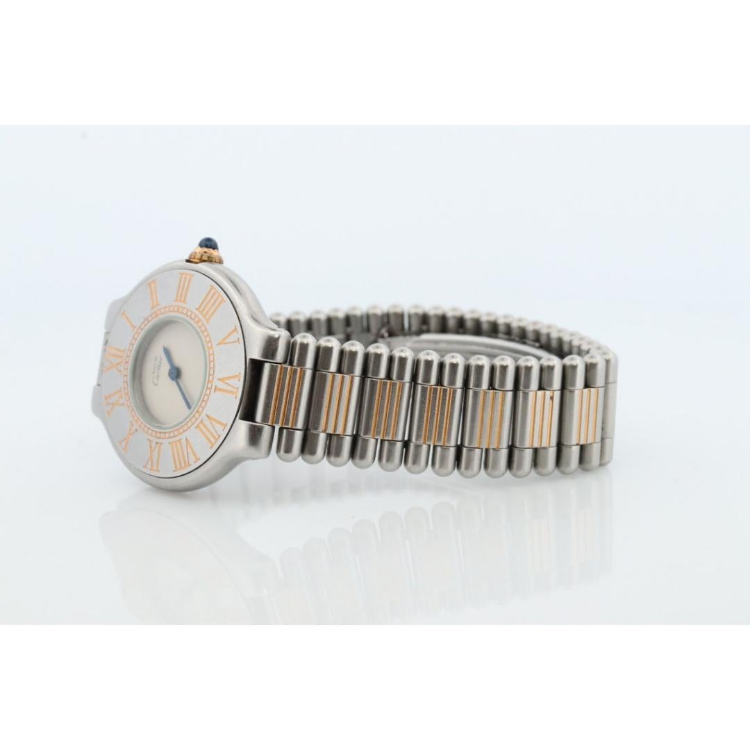 Vintage from the 1990s
Band material: Silver
Materials: Silver
Power: Mechanical
Readout: Analog

Style: Minimalist

Authentic Cartier watch. Vintage Must de Cartier 21

Gold tone Roman Numerals.

Condition: No cracks. Has Scratches around the case.