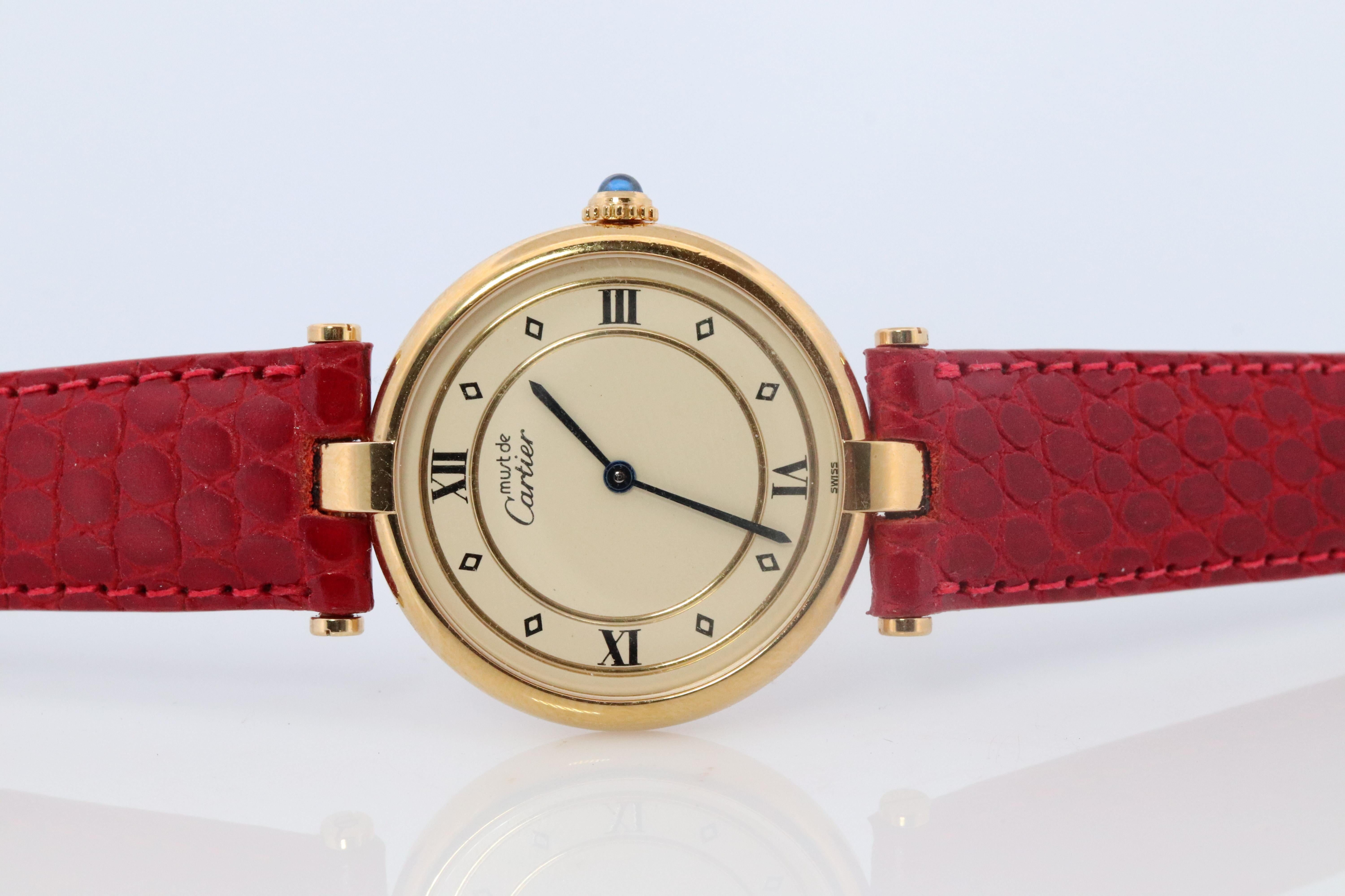Genuine Cartier watch.

Vintage Must de Cartier 30mm Vendome

Rare Cream Dial with Gold Outlines.

Sapphire Cabochon Crown.

Condition: Comes with Original Cartier case and Paperwork. Excellent Condition.

New battery installed.
New Leather band