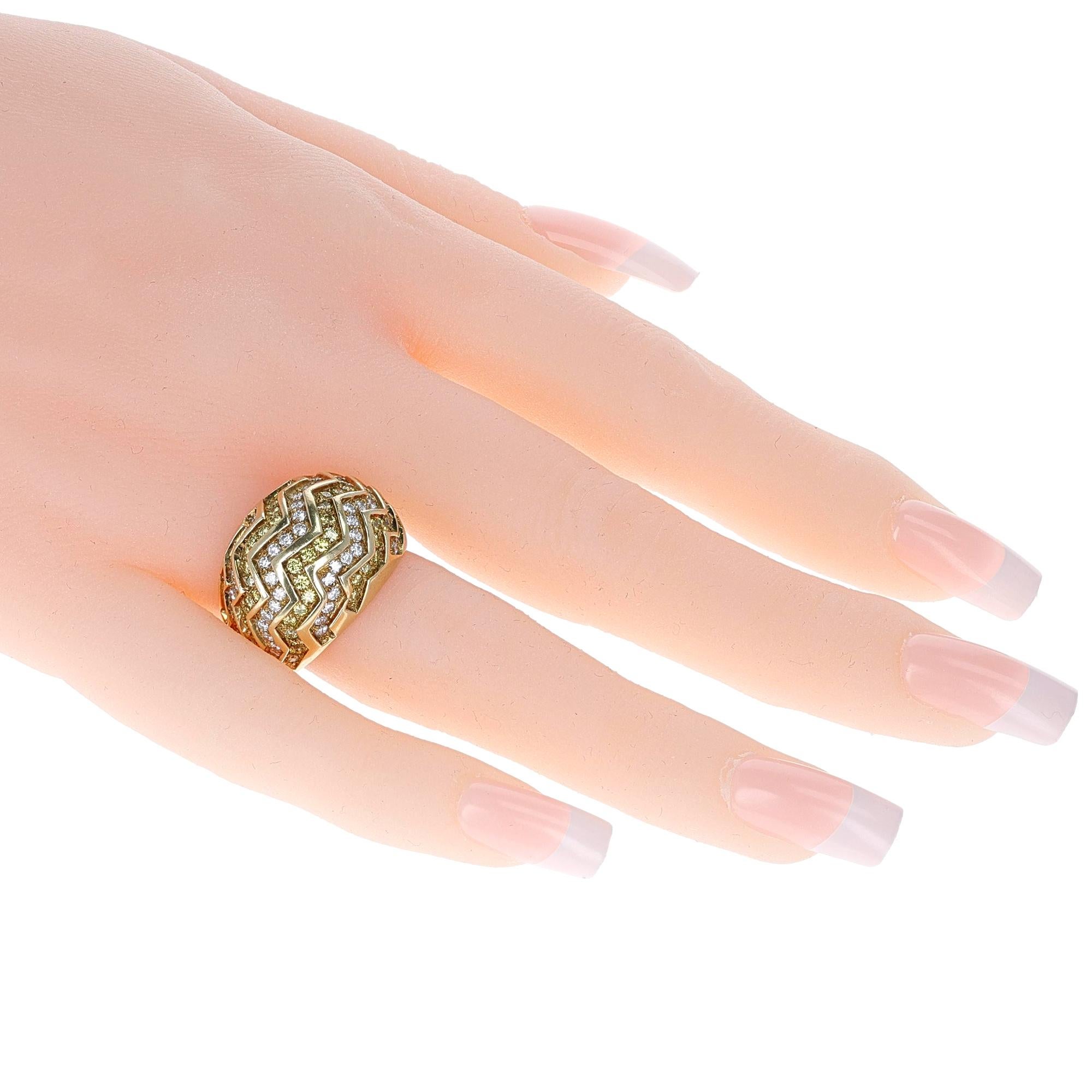 A Cartier White and Yellow Diamond Zig-Zag Bombe Ring made in 18 Karat Gold. The Ring Size is US 7.50. The total weight is 18.10 grams. 

SKU: 716-HEQALJP
