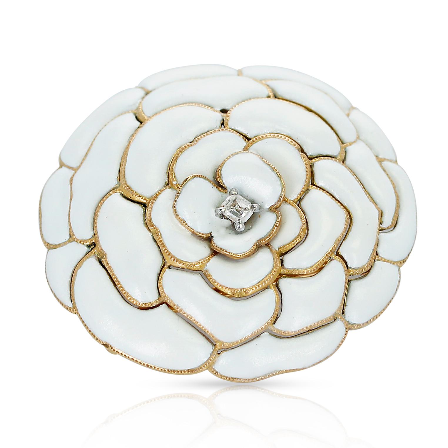 Cartier White Enamel and Diamond Floral Layer Brooch. The length is 3.50 CM, the width is 3.25CM. The total weight is 16.02 grams. There is one diamond in the center of the brooch.                                                                     
