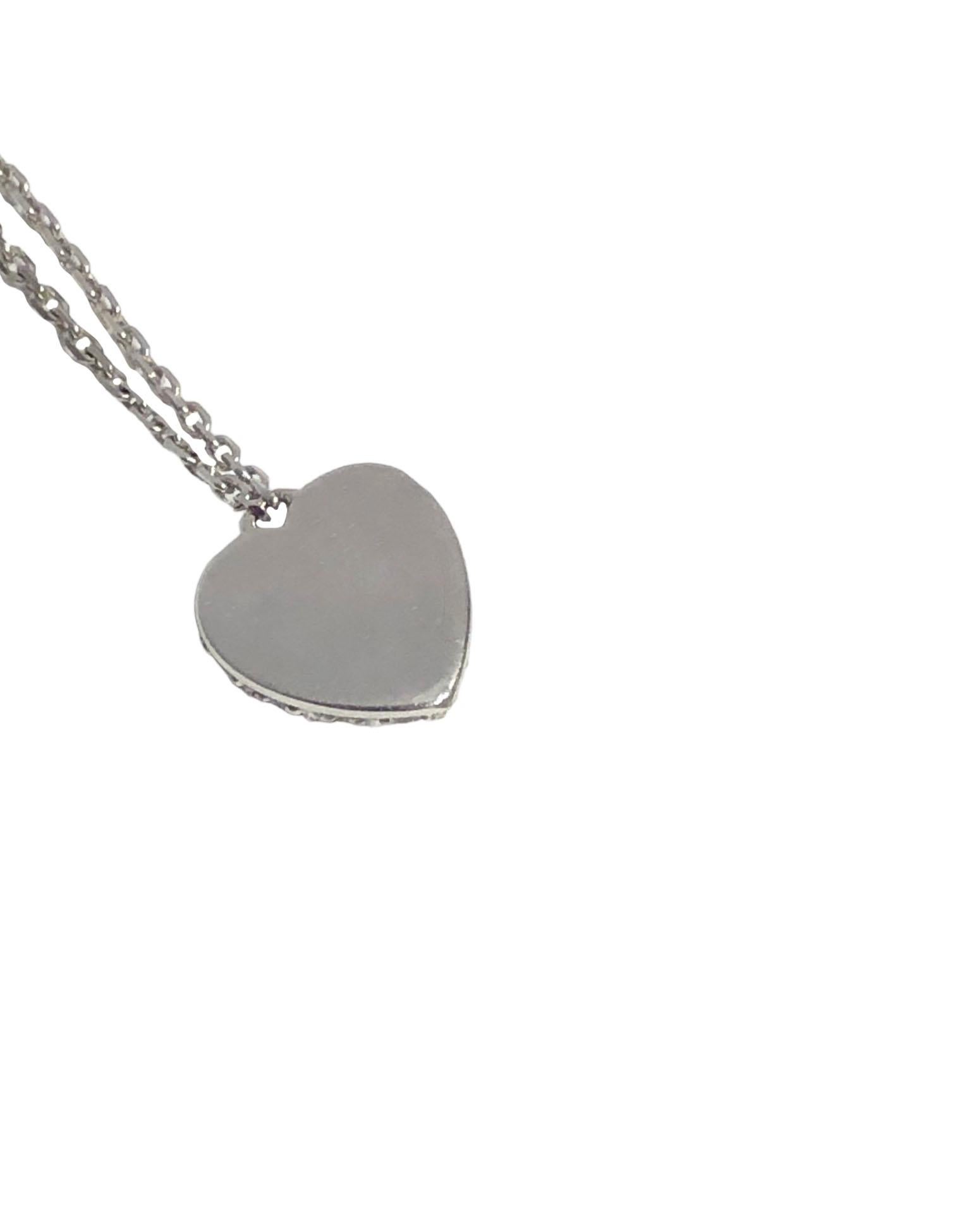 Circa 2010 Cartier Heart Pendant Necklace, 18k White Gold with the heart measuring 3/8 X 3/8 inch and is set with Round Brilliant cut Diamonds totaling 1/2 Carat. Suspended from a 16 inch link chain. Signed and numbered.