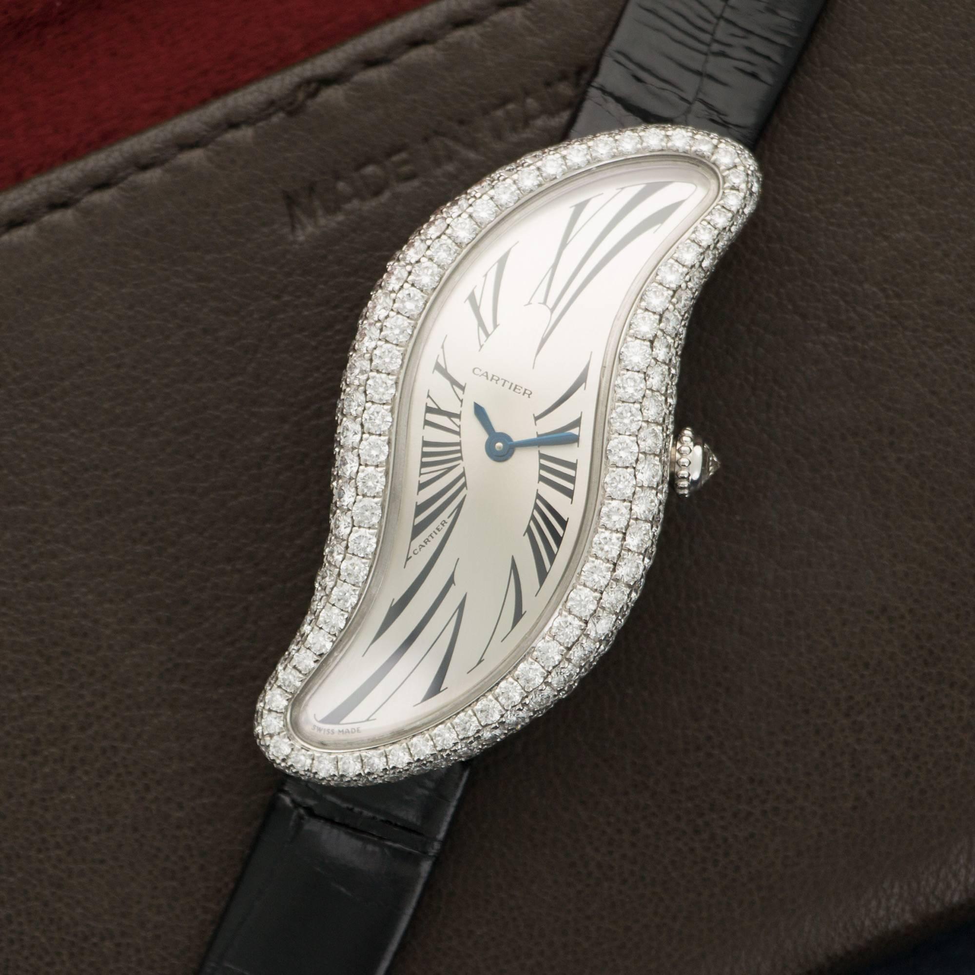 An 18k White Gold S-Shape Watch, by Cartier. Salvador Dali Inspired Design. All Original Diamonds. Manual-Winding. Reference number 3174. Mint Original Condition. 