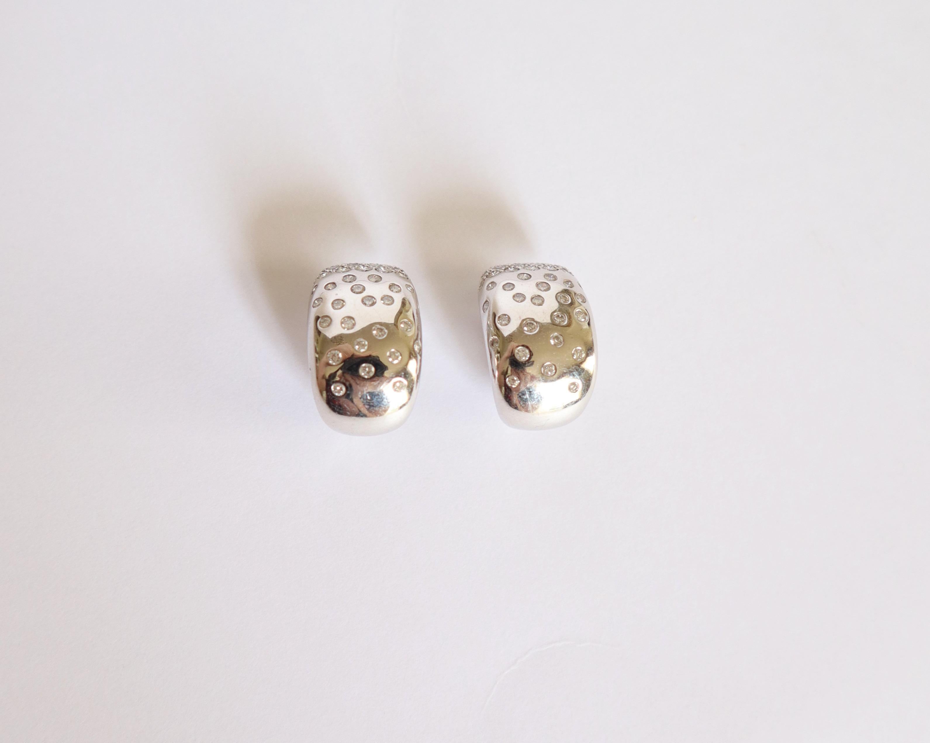 Women's Cartier White Gold Clip Earrings Paved with Diamonds For Sale