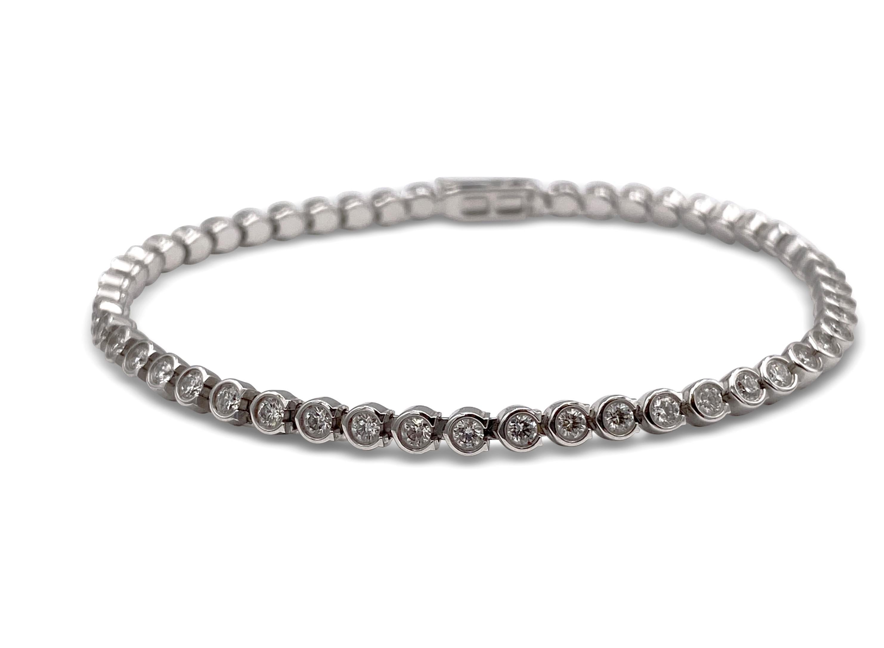 Authentic Cartier C de Cartier line bracelet made in 18 karat white gold.  The bracelet features 52 round brilliant cut diamonds with a total weight of approximately 1.50 cts. CIRCA 2010's.  Can fit up to a size 6 1/4 wrist comfortably.  Bracelet is