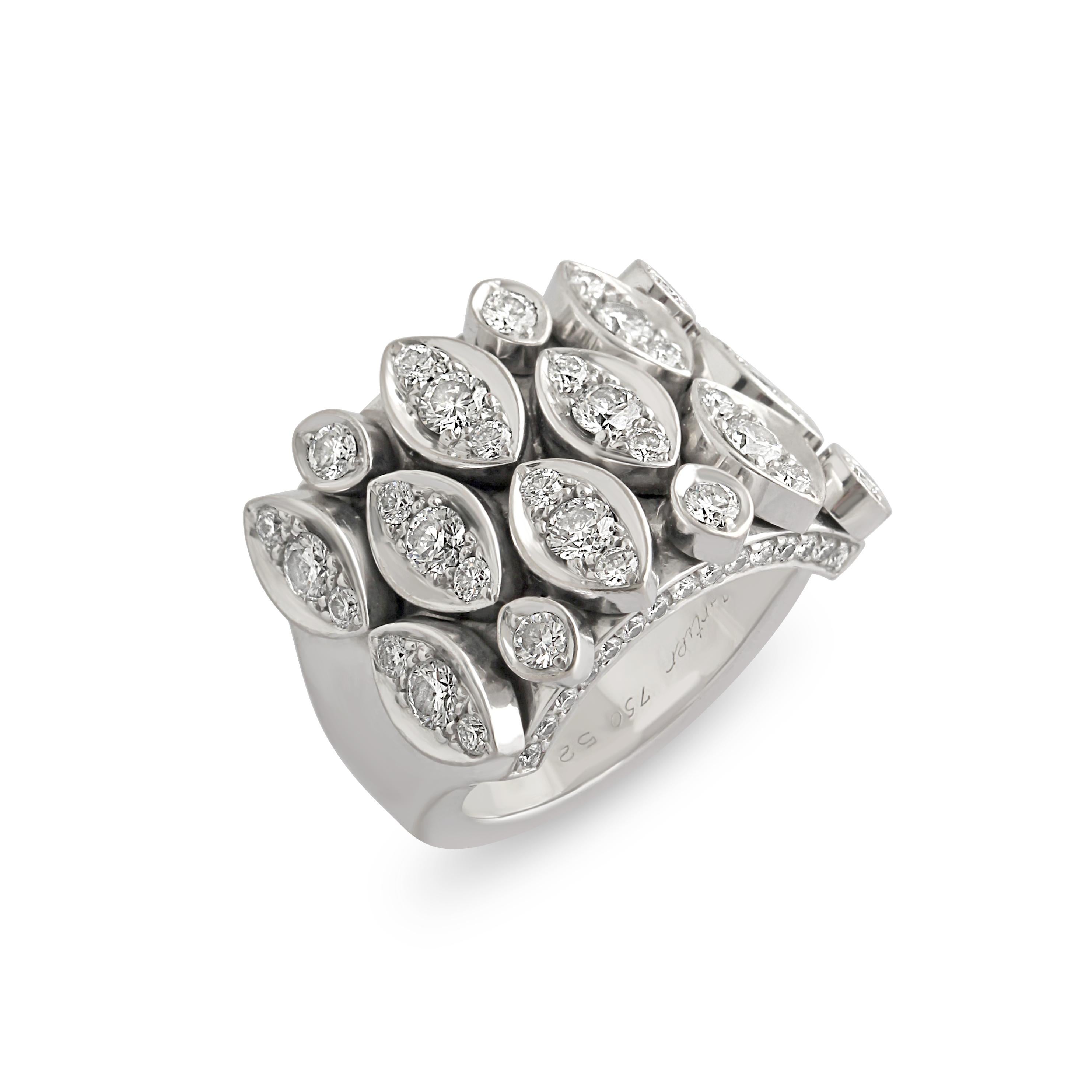 An 18k white gold and diamond ring ‘Diadea’ Ring by Cartier. A large cocktail ring with marquise shaped articulated panels set with diamonds, total diamond weight = approximately 1.60 carats.
