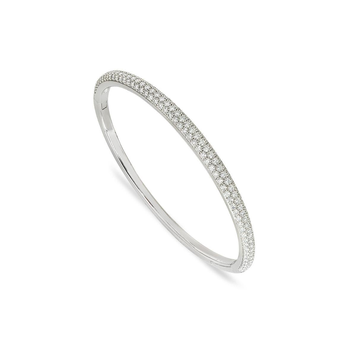 A sparkly 18k white gold diamond Cartier bracelet from the Etincelle collection. The bracelet comprises of 3 rows of pave set diamonds, a total of 163 round brilliant cut diamonds, totalling approximately 2.02ct, all well matched in colour and