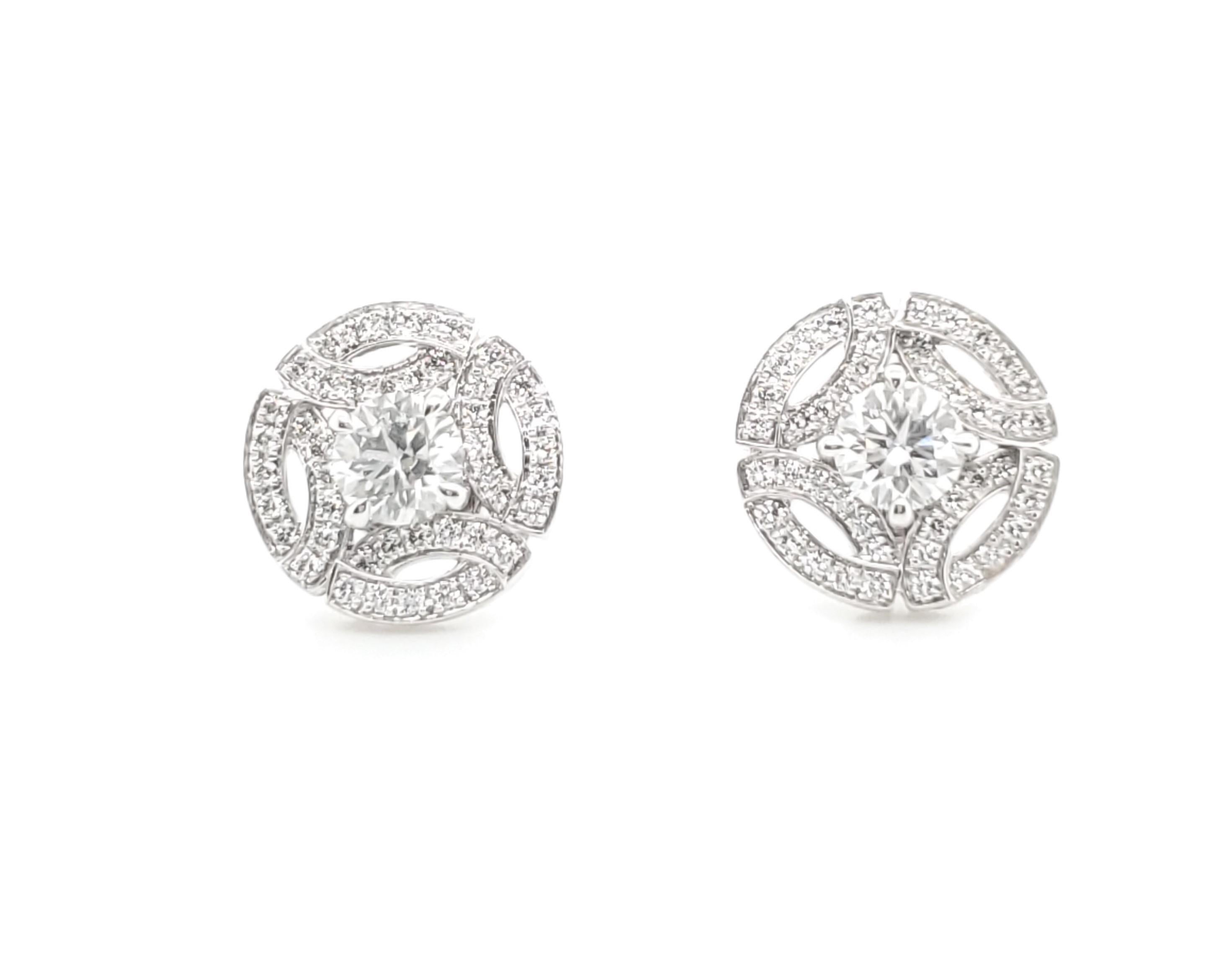 Authentic Cartier Earrings made with 18 karat white gold and diamonds.  Approximately 82 diamonds (D-E color, VVS1) with center stones weighing approximately .40 carats, surrounded by approximately .8 carats of pave diamonds.  CIRCA 2014. Stamped