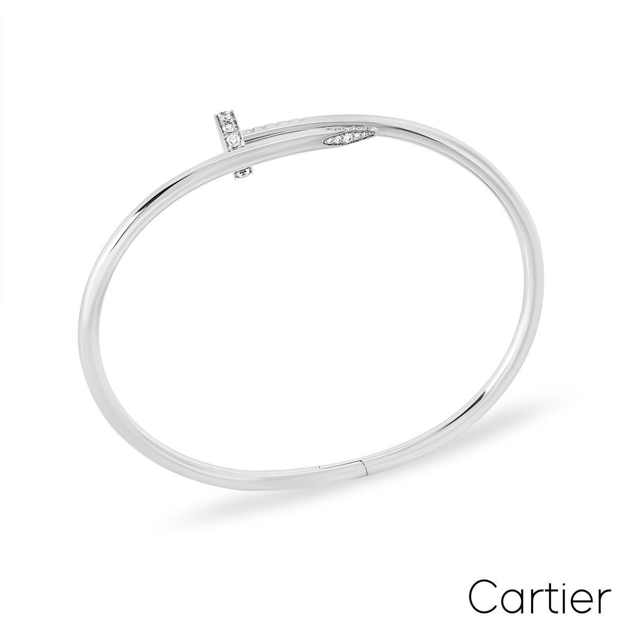 A signature 18k white gold Cartier diamond bracelet from the Juste Un Clou collection. This bracelet has style of a nail with 32 round brilliant cut pave diamonds set in the head and tip, totalling 0.58ct. The diamonds are predominantly F colour and