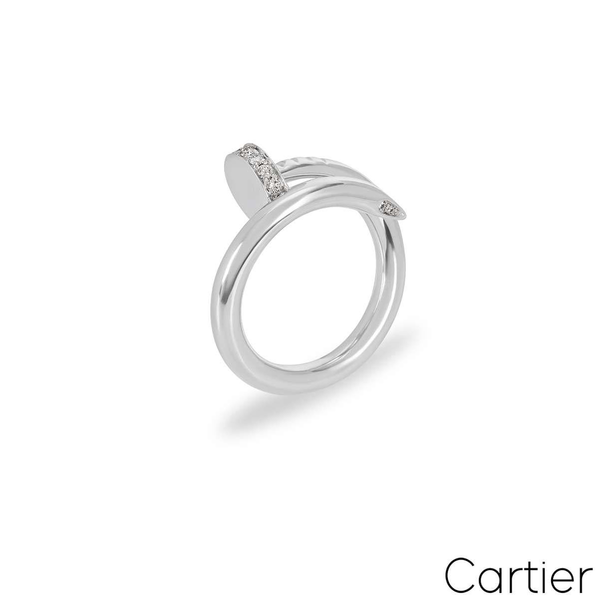 An 18k white gold diamond ring by Cartier from the Juste un Clou collection. The ring is in the style of a nail and has 22 round brilliant cut diamonds set in the head and tip with a total weight of 0.13ct. A size UK L - EU 51 and this ring has a